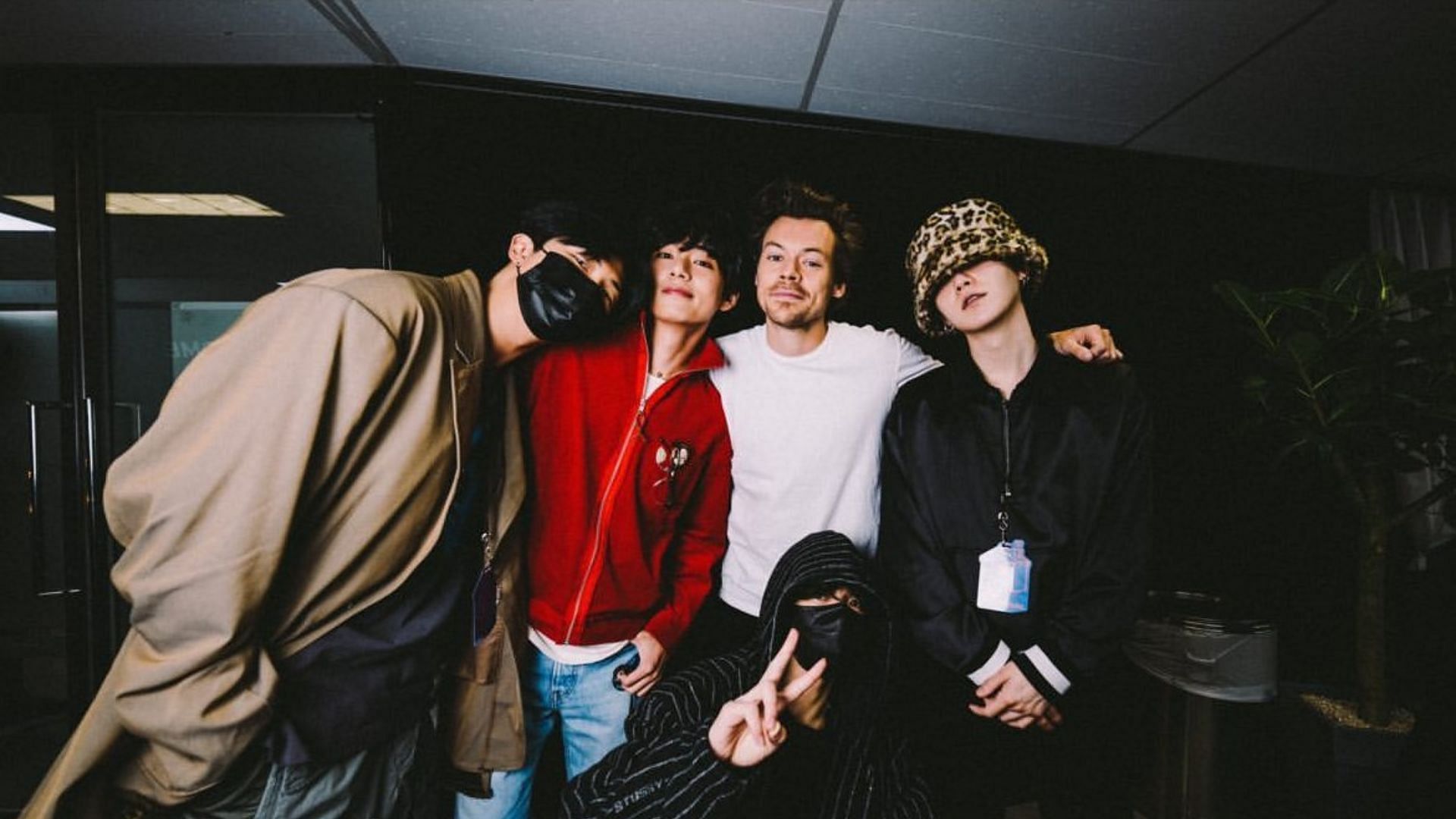 K-pop idol group BTS with Harry Styles at his concert in Seoul.