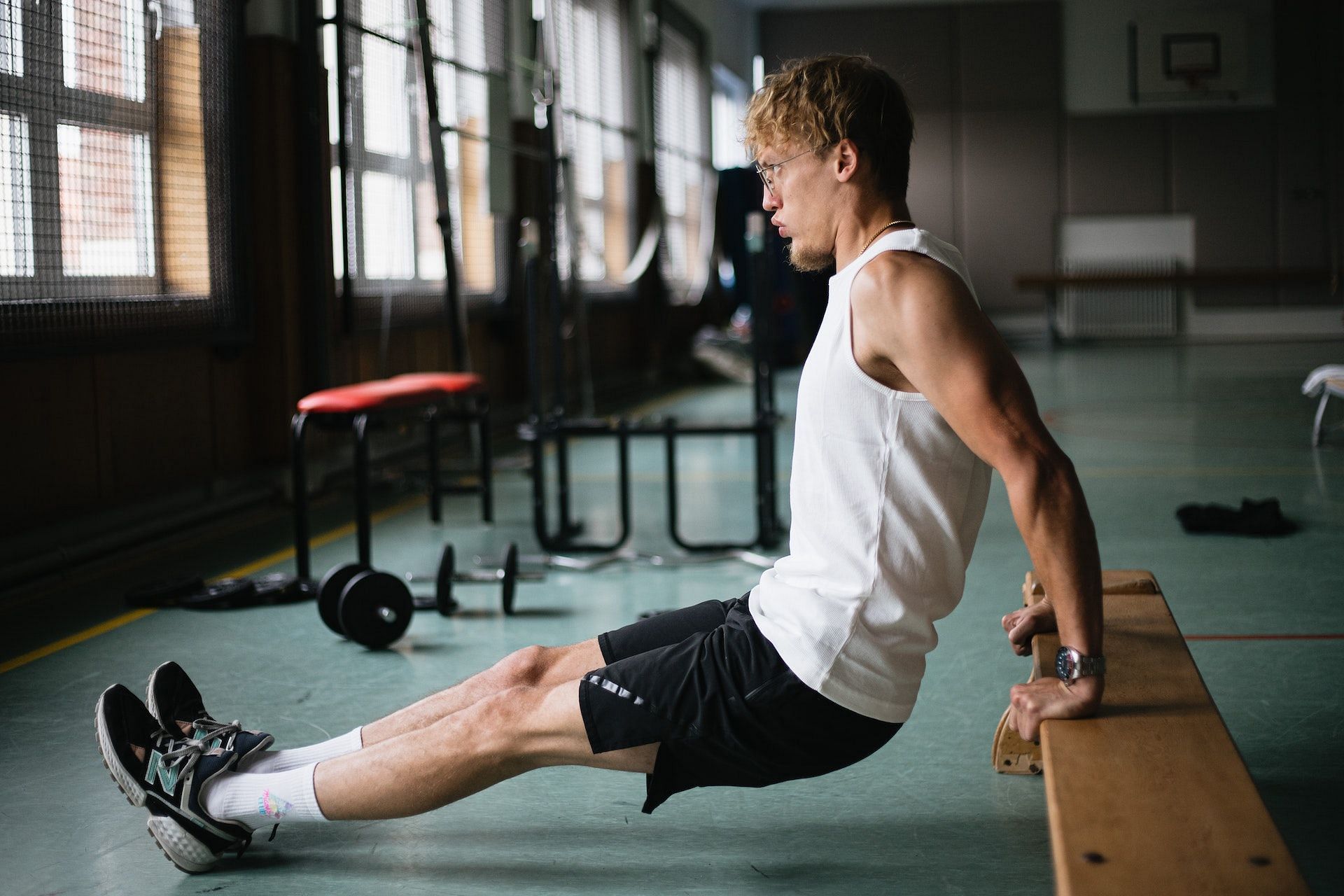 Bench dips are a great dips exercise to add to your workout. (Photo via Pexels/Sinitta Leunen)