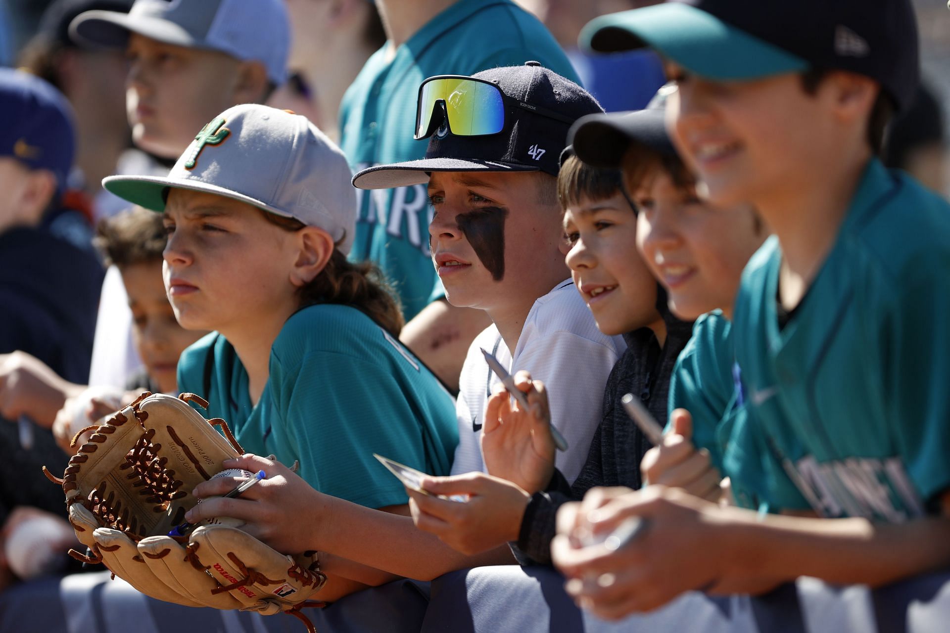 Seattle Mariners fans look on before a spring training game against the San Diego Padres at Peoria Stadium