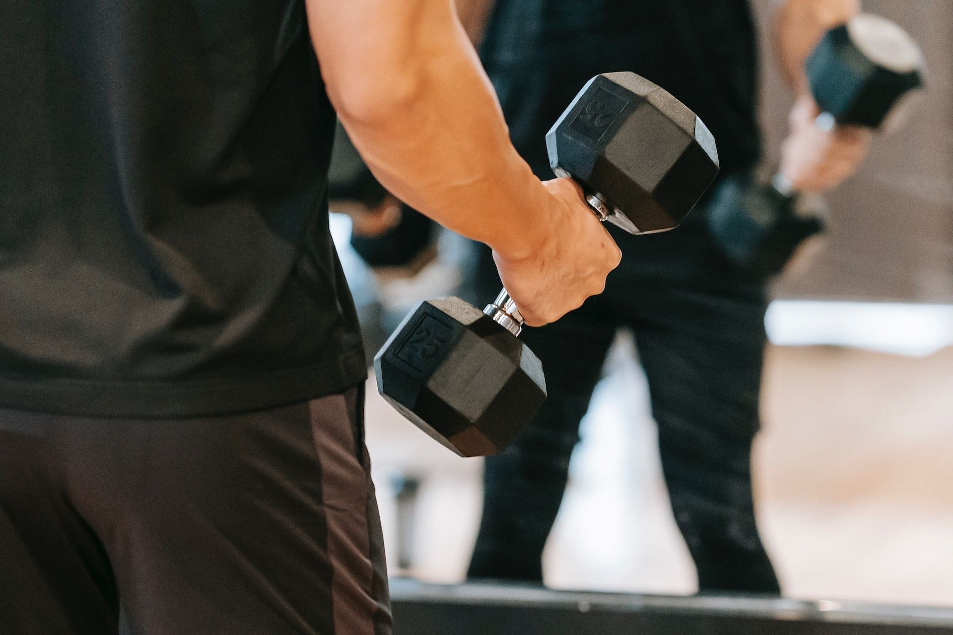 Dumbbell good morning is a great lower back strengthening exercise. (Photo via Pexels/Andres Ayrton)