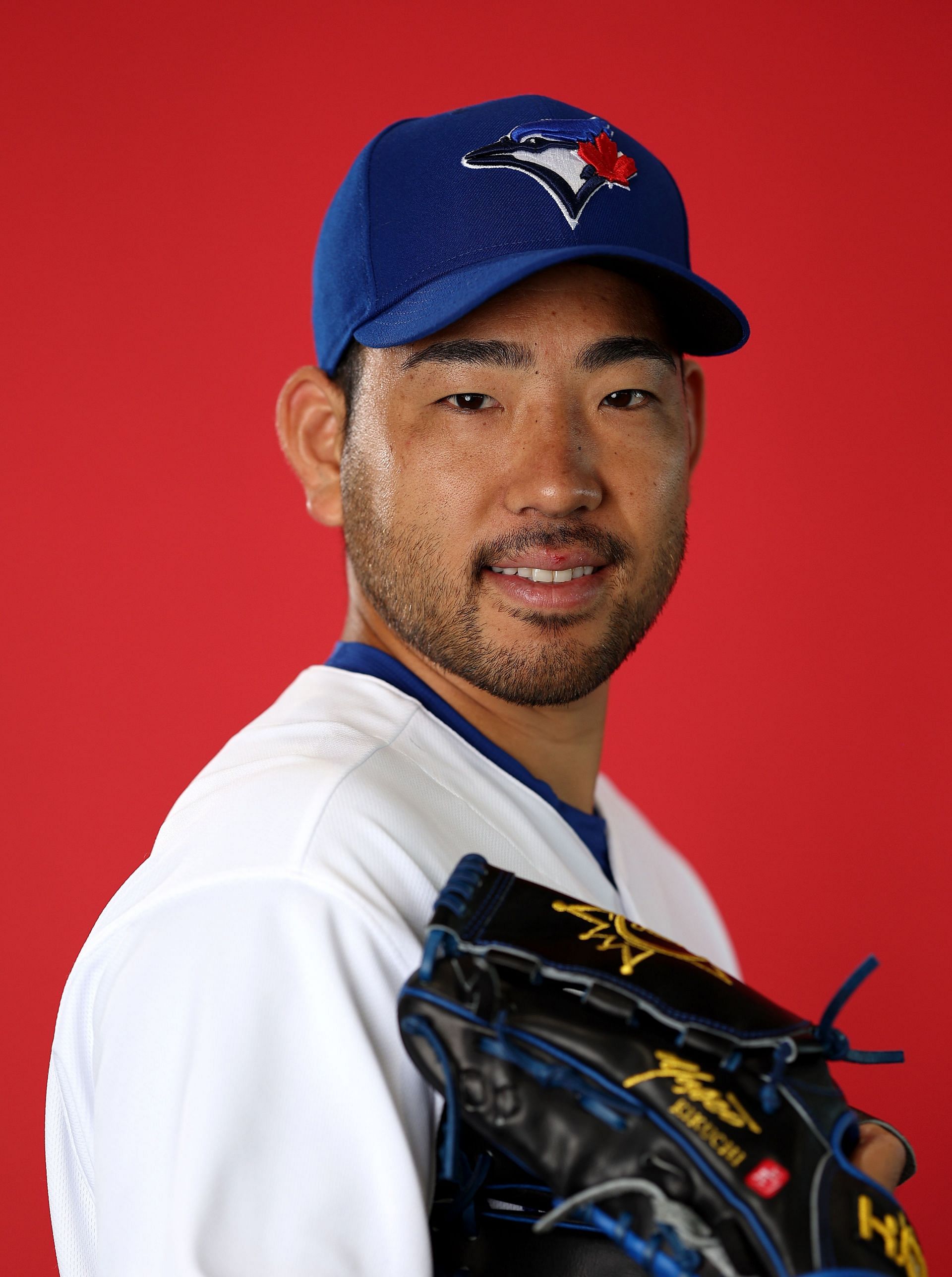 Yusei Kikuchi #16 of the Toronto Blue Jays poses for a portrait during Toronto Blue Jays Photo Day