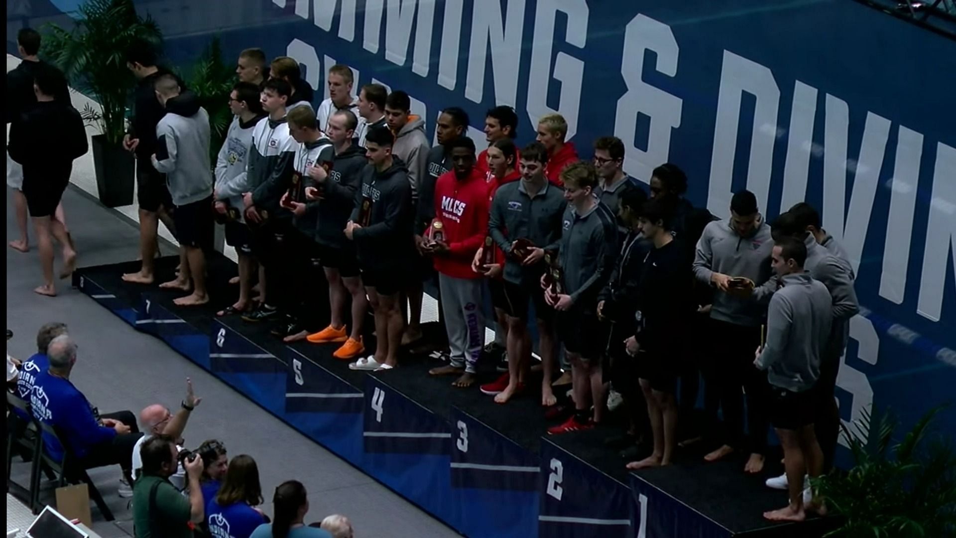 Swimmers pose on the podium during Day 2 of the 2023 NCAA Division II Championships (Image via YouTube/NCAA Championships)