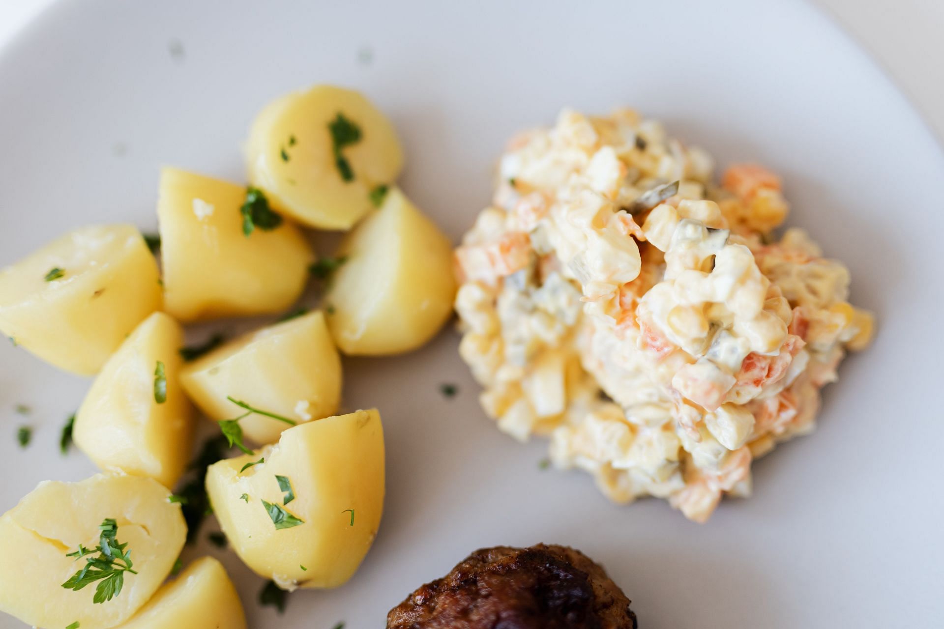 Egg salad with oven-roast potatoes. (Image Via Pexels/ Karolina Grabowska)