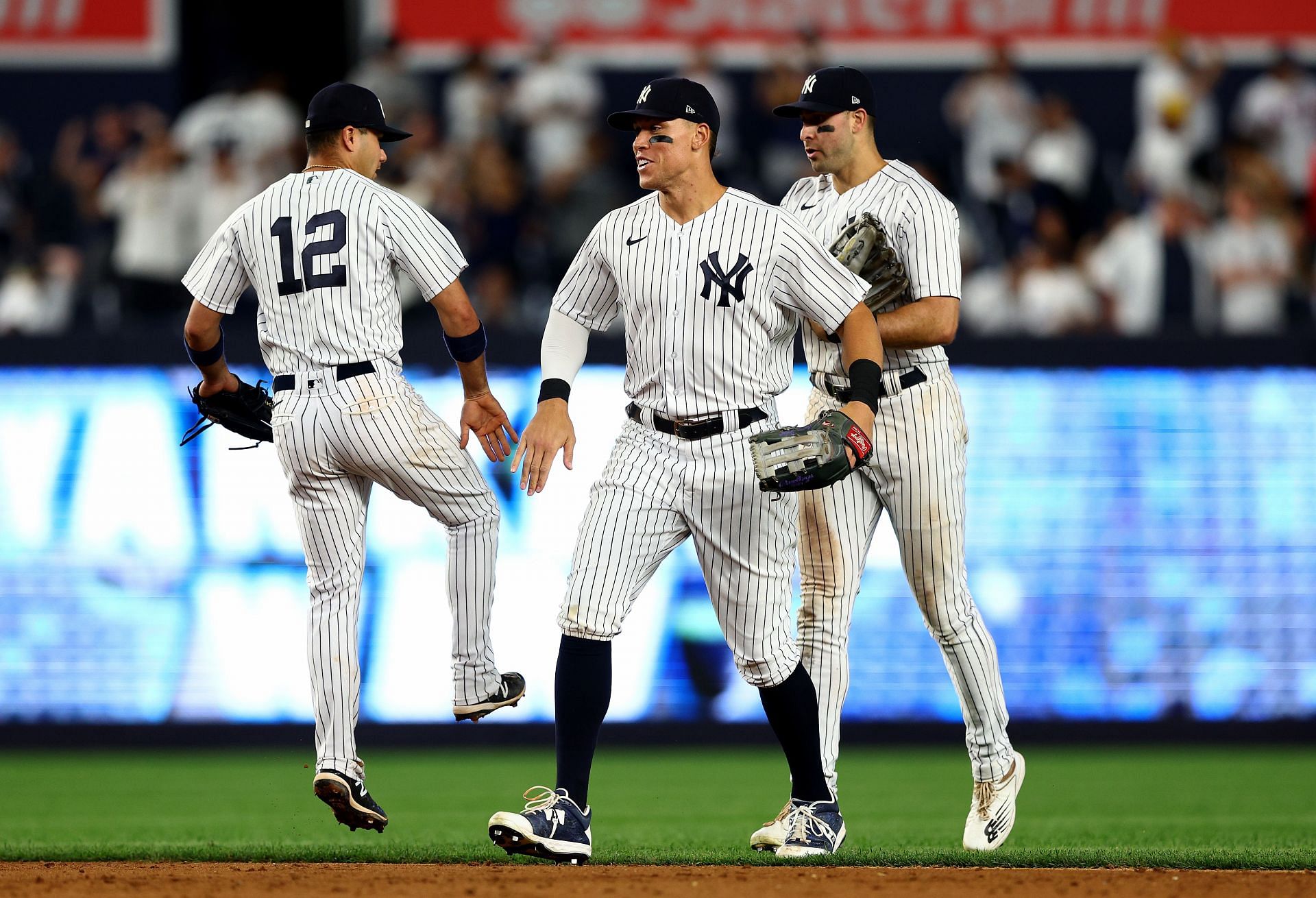 Isiah Kiner-Falefa #12, Aaron Judge #99 and Joey Gallo #13 of the New York Yankees celebrate the win over the Los Angeles Angels at Yankee Stadium on May 31, 2022 in the Bronx borough of New York City. The New York Yankees defeated the Los Angeles Angels 9-1.
