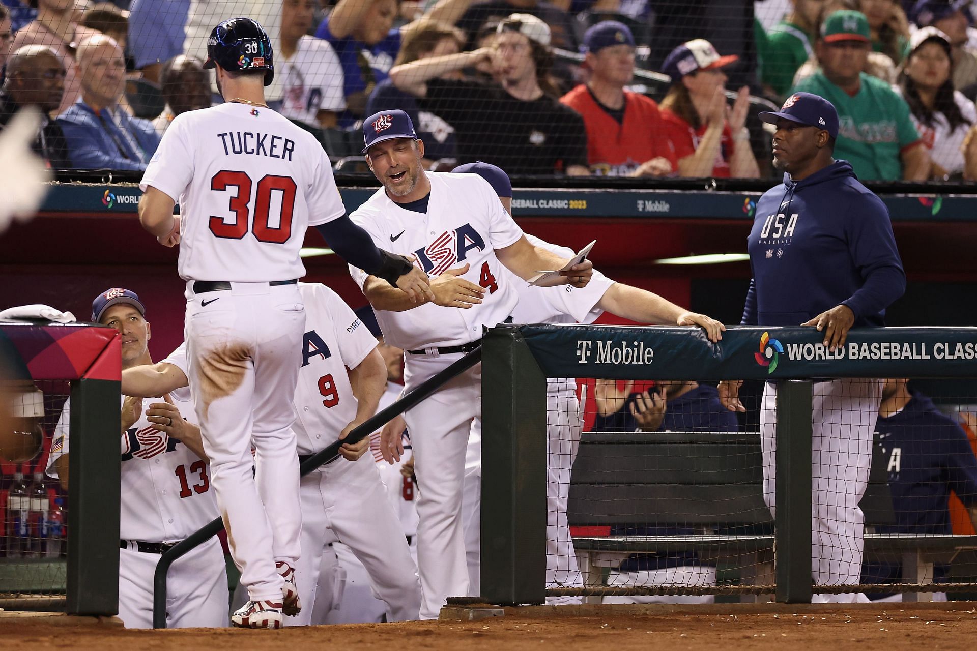 Manager Mark DeRosa high fives Kyle Tucker during the World Baseball Classic at Chase Field