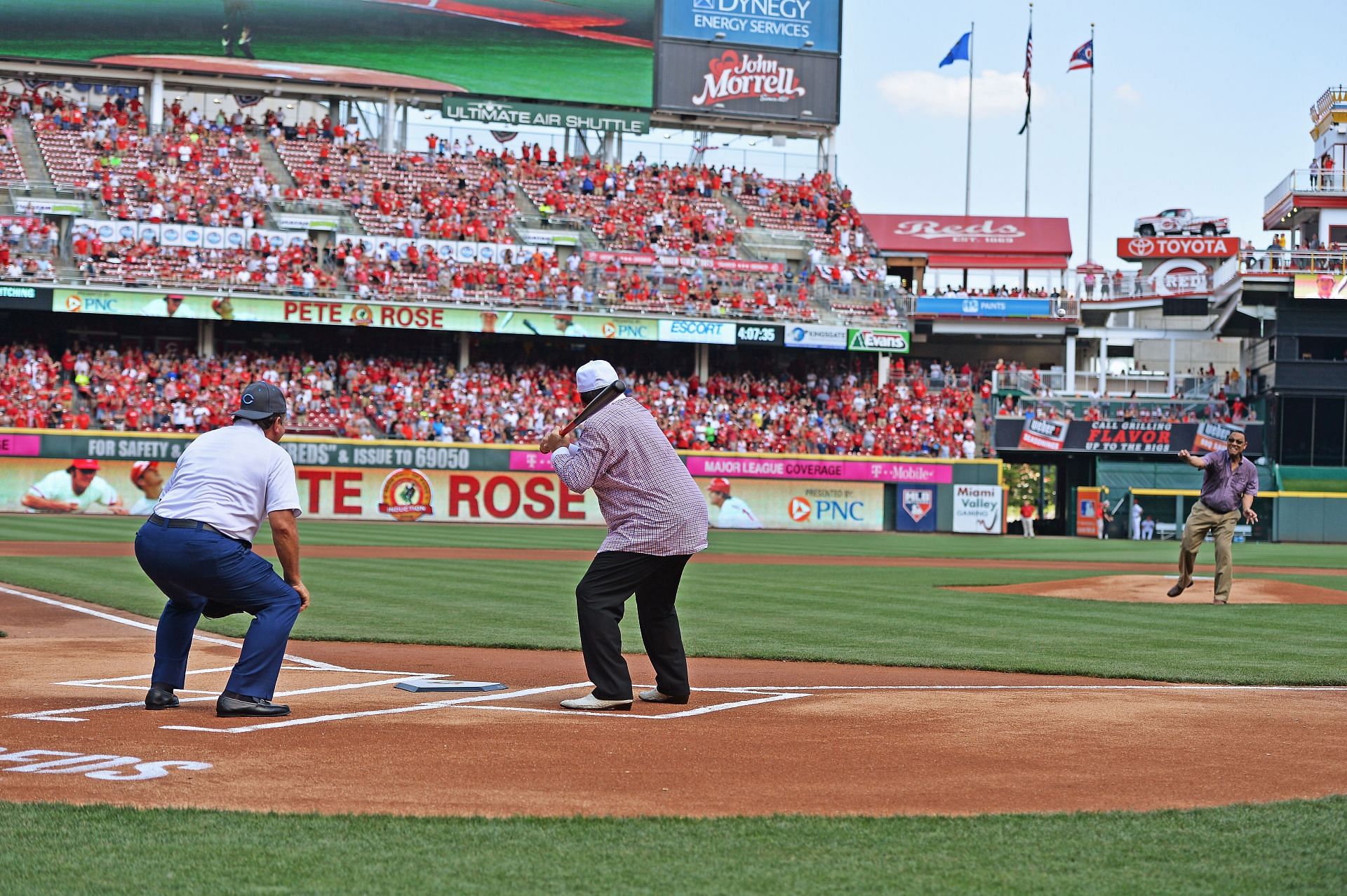 Former Cincinnati Reds player and Major League Baseball all-time hits leader Pete Rose takes a pitch from former Reds player Tony Perez while former Reds player Johnny Bench catches during his induction in to the Reds Hall of Fame before a game between the Cincinnati Reds and the San Diego Padres at Great American Ball Park on June 25, 2016, in Cincinnati, Ohio.