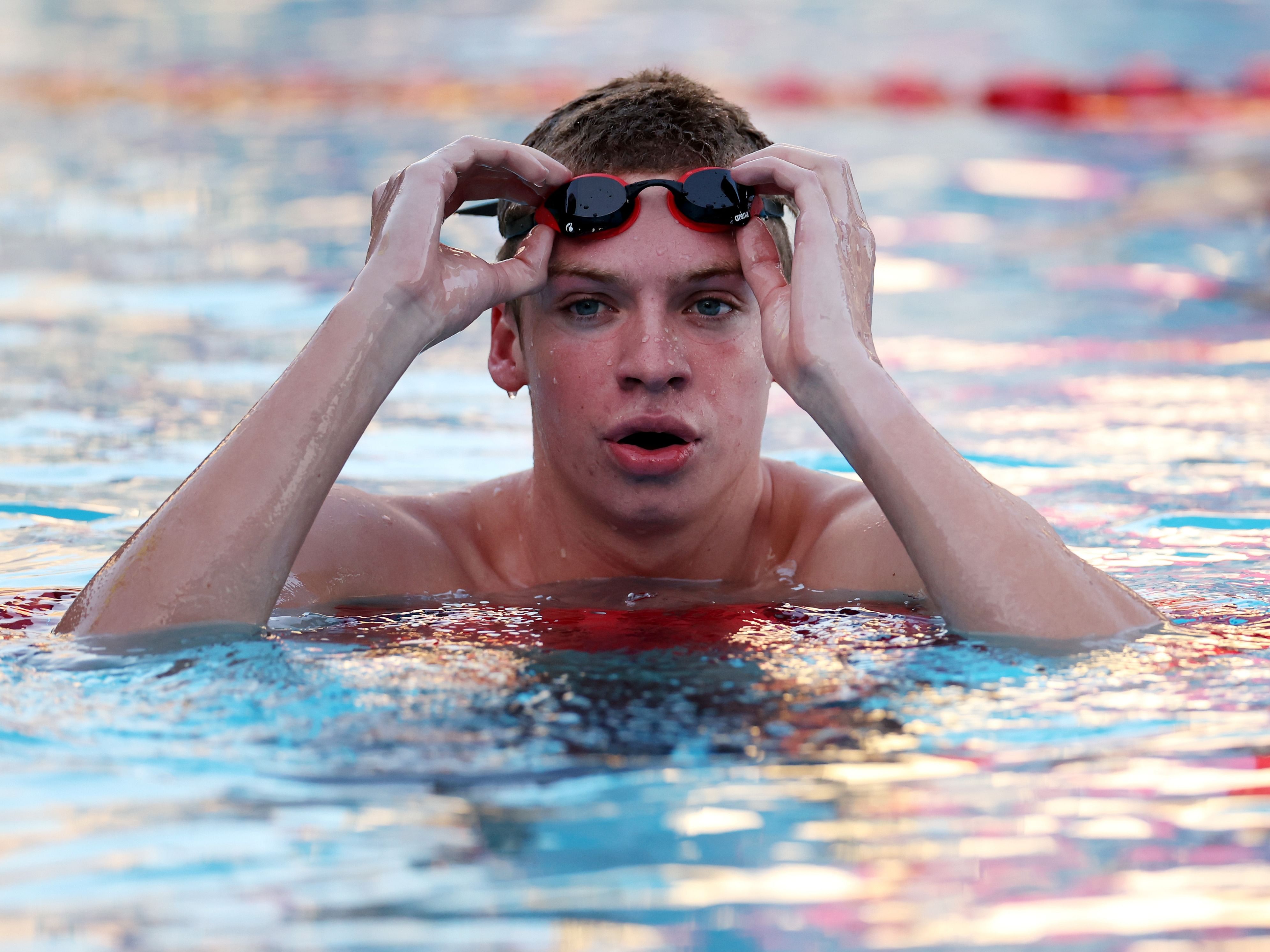  Leon Marchand looks on after winning the Men