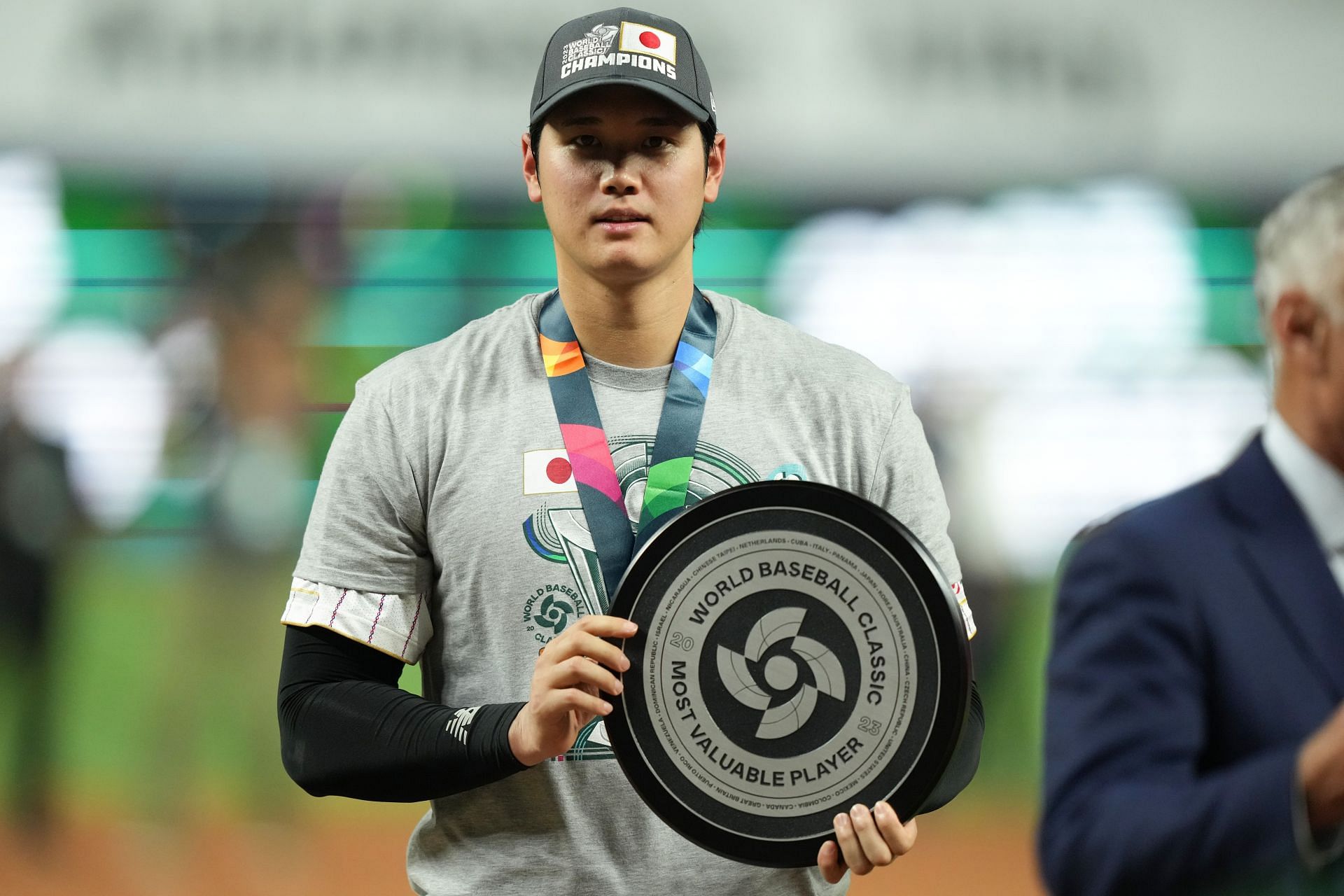 Shohei Ohtani of Team Japan applauds fans after awarded the MVP award by Commissioner of Baseball Rob Manfred after defeating Team USA in the WBC Championship