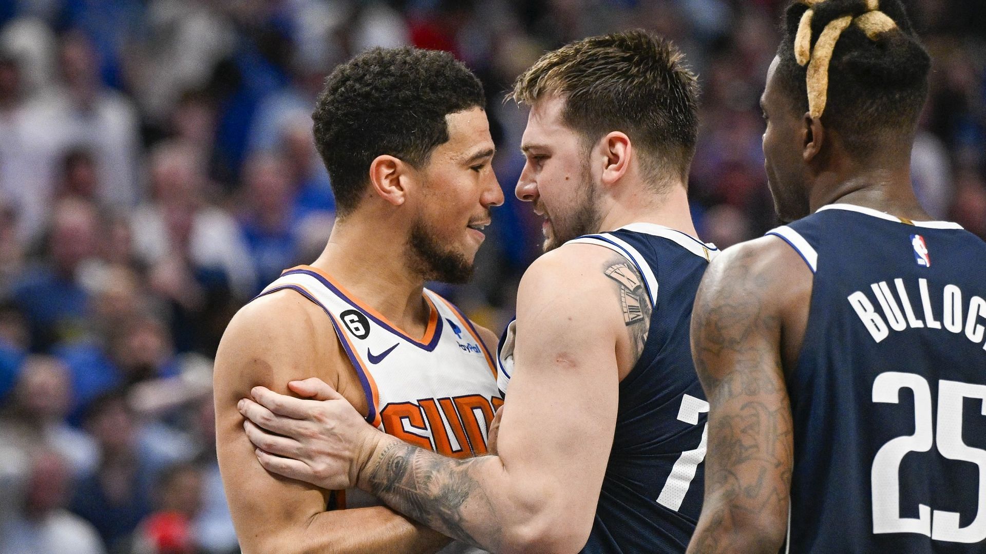 NBA stars Devin Booker and Luka Doncic during their fourth-quarter altercation on Sunday