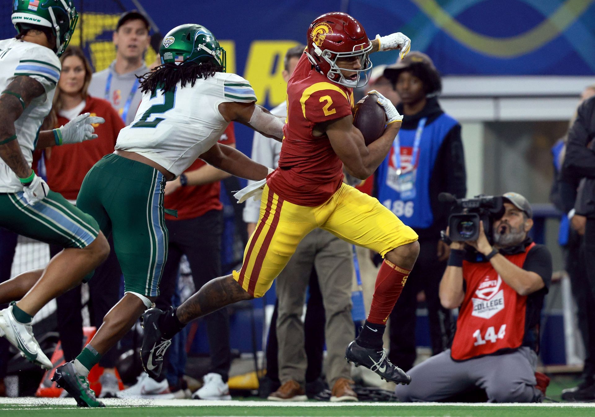Brenden Rice #2 of the USC Trojans carries the ball against Dorian Williams #2 of the Tulane Green Wave