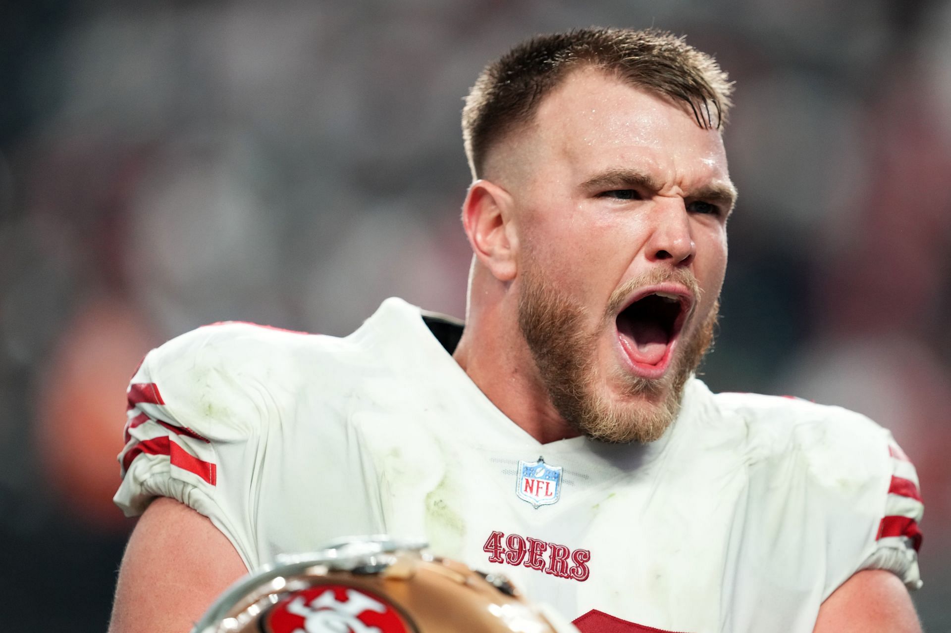 Mike McGlinchey #69 of the San Francisco 49ers celebrates an overtime win against the Las Vegas Raiders