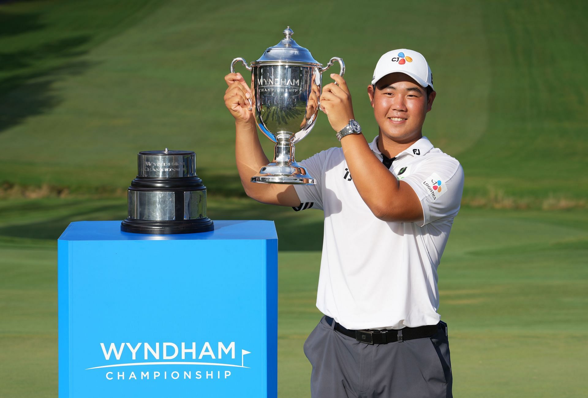 Kim poses with the Wyndham Championship trophy at Sedgefield Country Club in Greensboro, North Carolina.