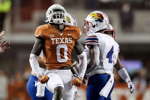 Texas linebacker DeMarvion Overshown celebrates on the field