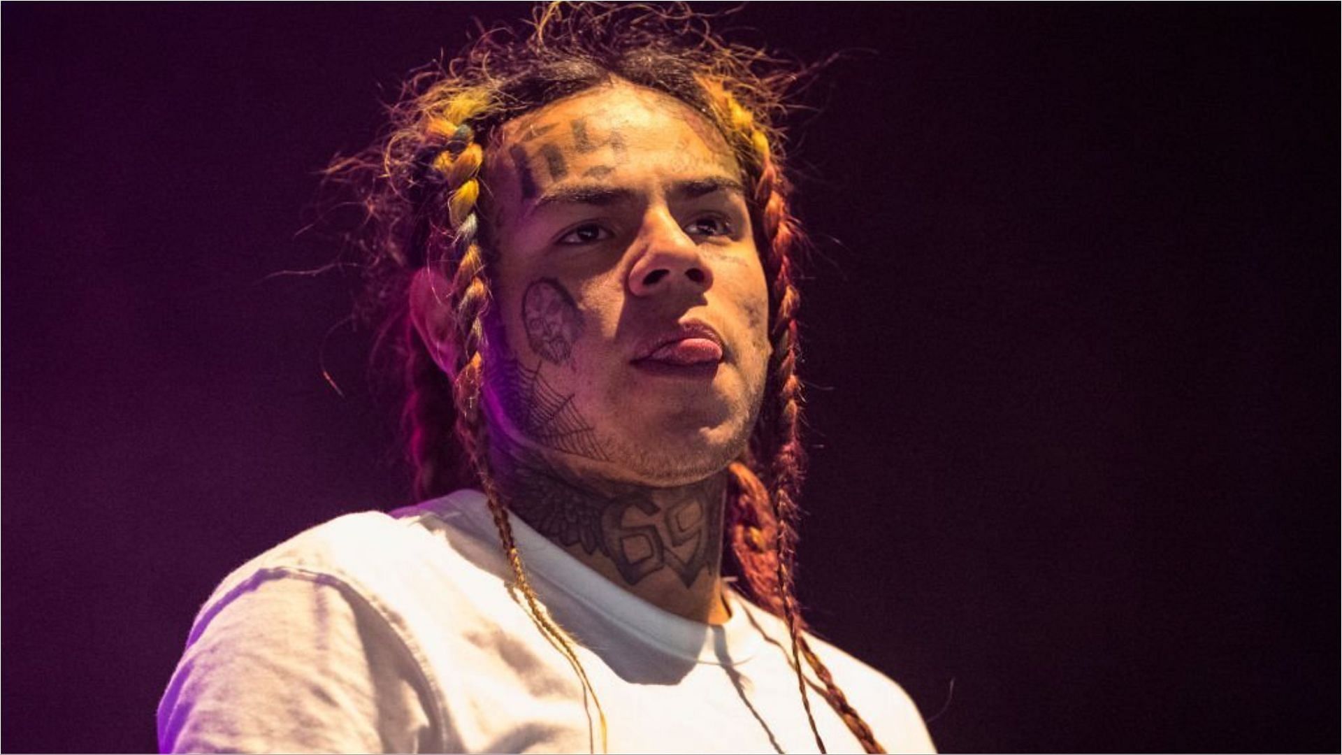 6ix9ine was attacked by a group of three people inside a sauna at a gym (Image via Michael Campanella/Getty Images)