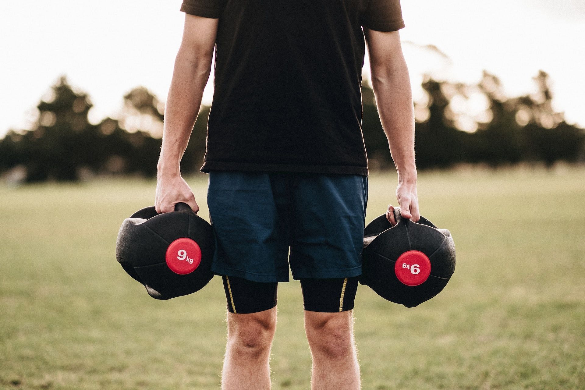 Shoulder shrugs are an incredible shoulder strengthening exercise. (Photo via Pexels/Micah Boerma)