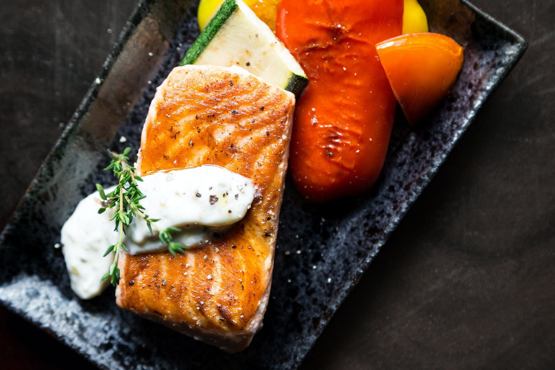 Oven-cooked salmon with grilled veggies. (Image via Pexels/ Malidate Van)