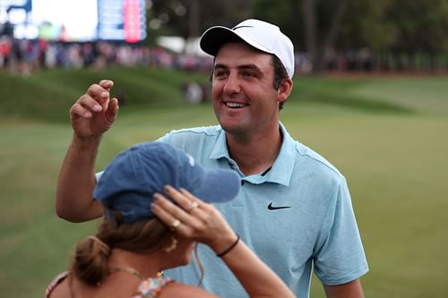 Scottie Scheffler celebrates with his wife Meredith Scudder after winning The Players Championship at TPC Sawgrass