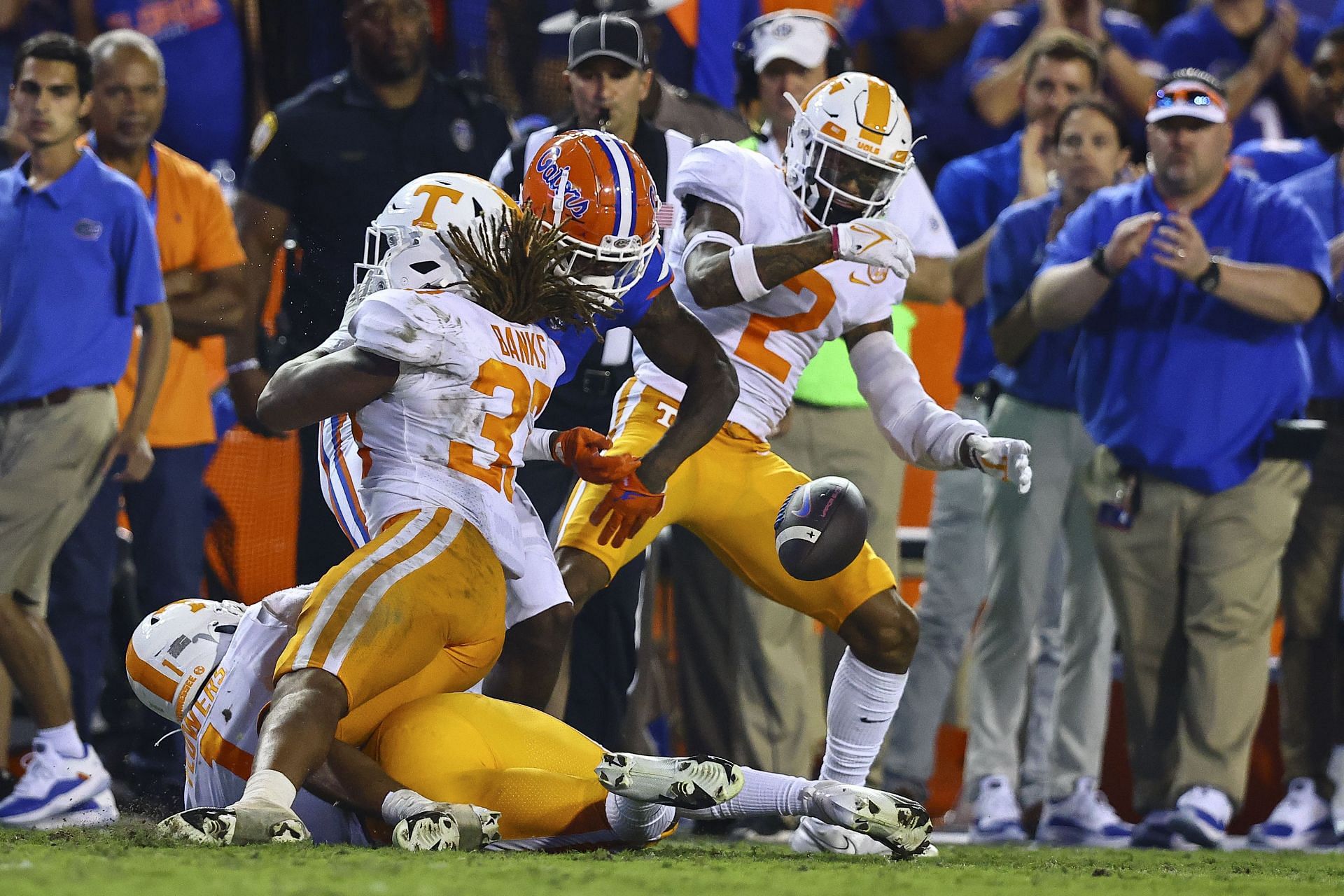 Jeremy Banks #33 of the Tennessee Volunteers forces a fumble against Jacob Copeland #1 of the Florida Gators