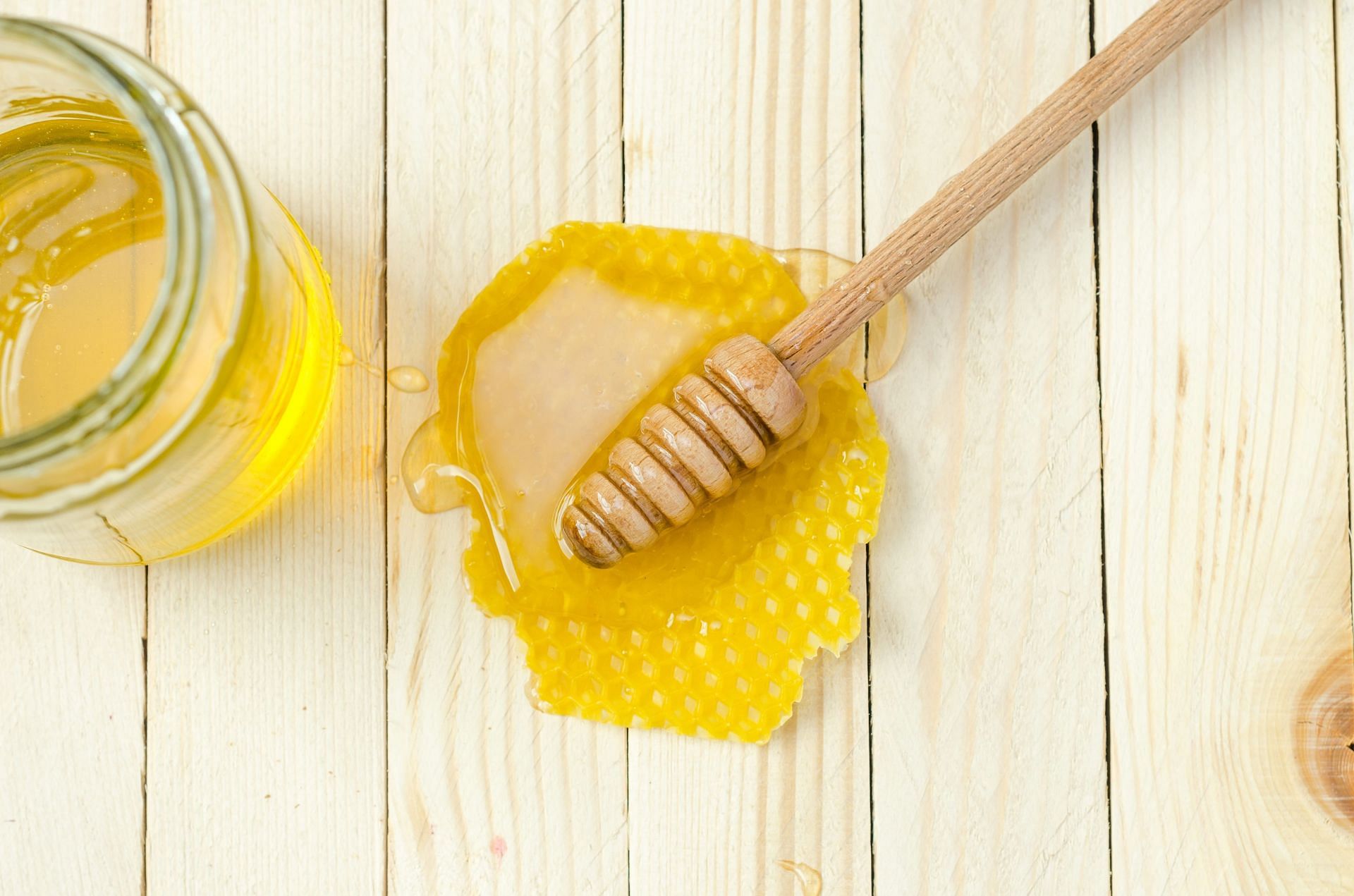 Honey as a pre-workout supplement (Image via Unsplash/Alexander Mils)
