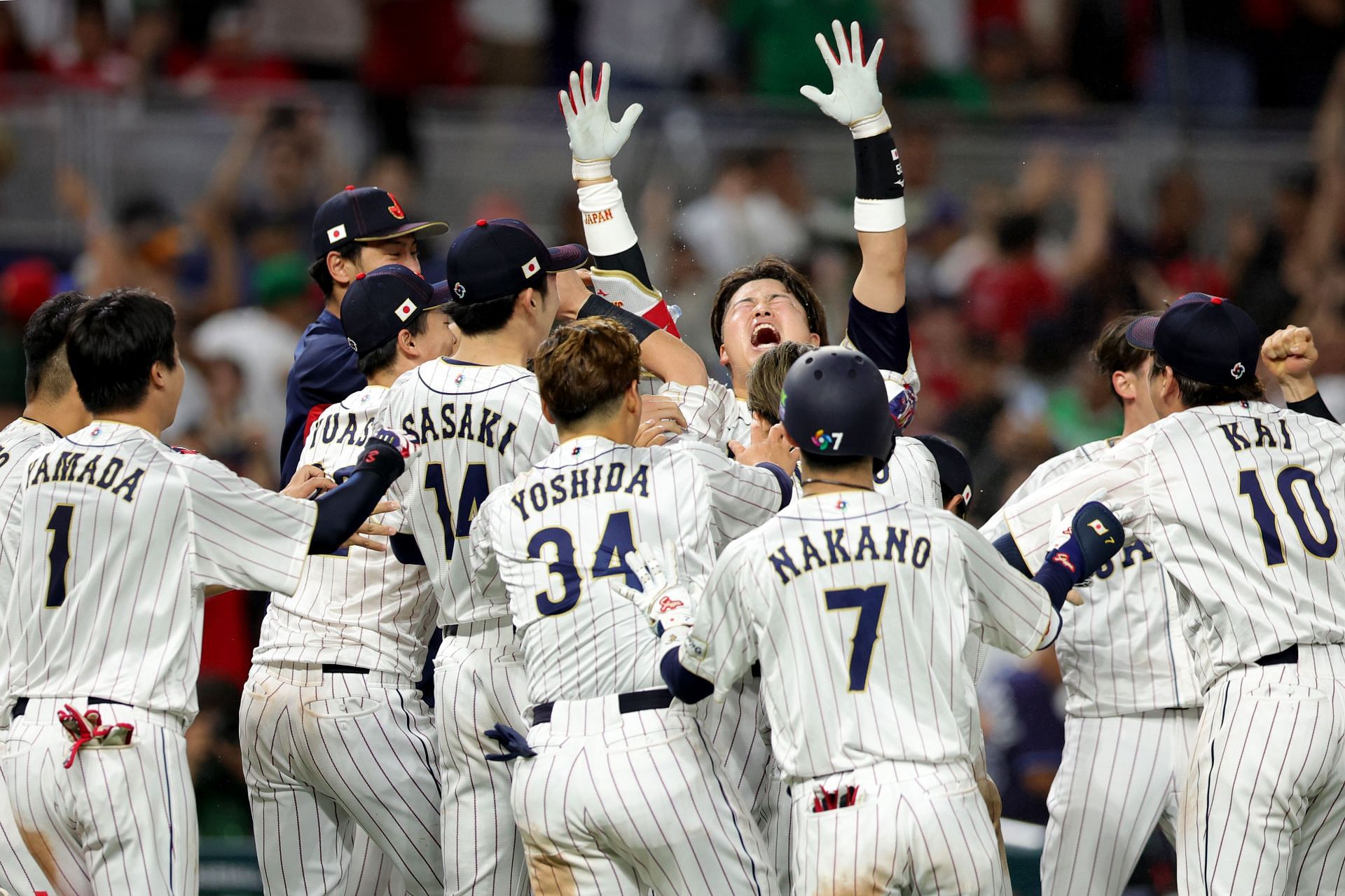 Munetaka Murakami #55 of Team Japan celebrates with teammates after hitting a two-run double to defeat Team Mexico 6-5 in the World Baseball Classic Semifinal