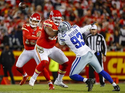 Orlando Brown #57 of the Kansas City Chiefs blocks Tarell Basham #93 of the Dallas Cowboys