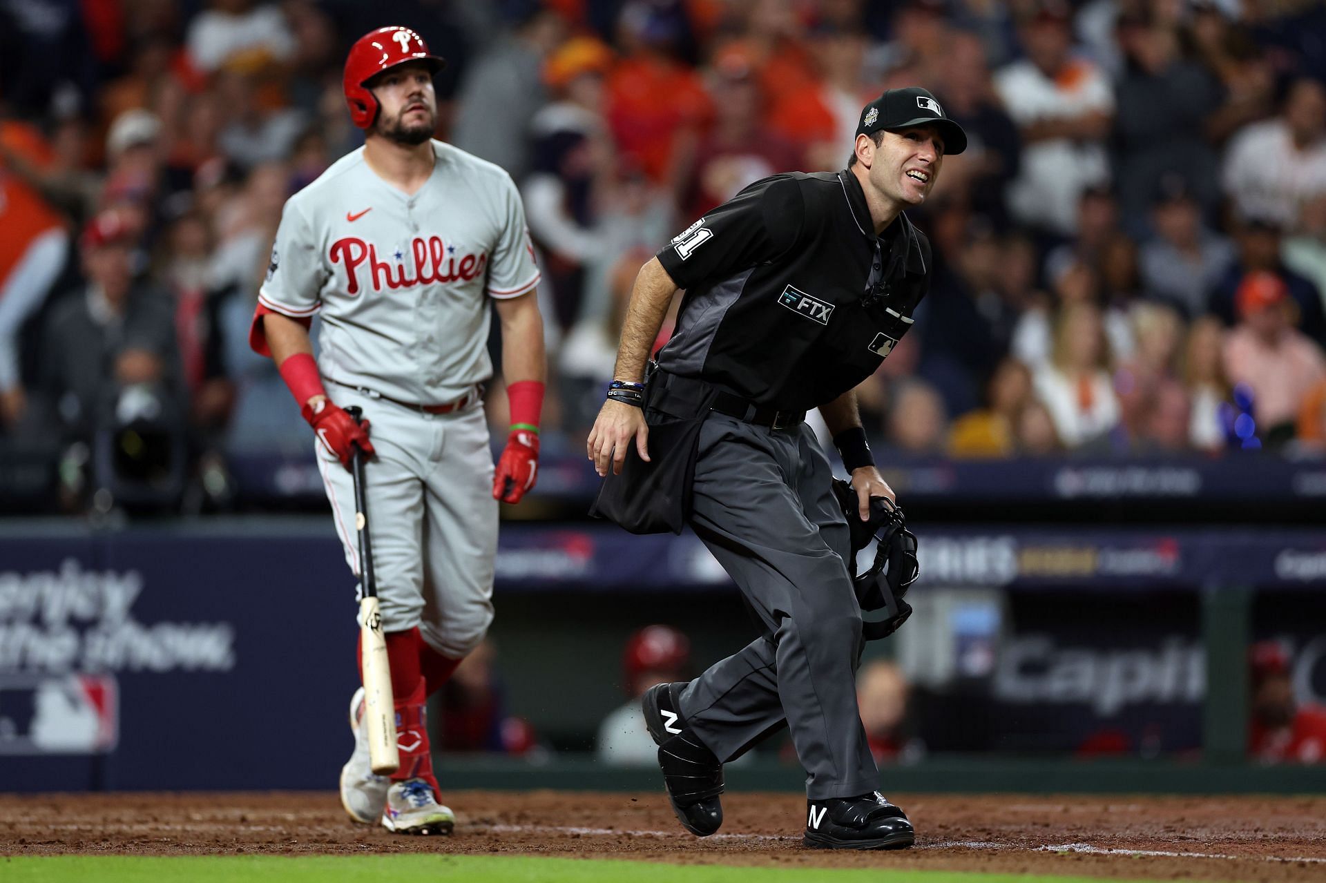 J.T. Realmuto ejected after bizarre failed ball exchange with umpire