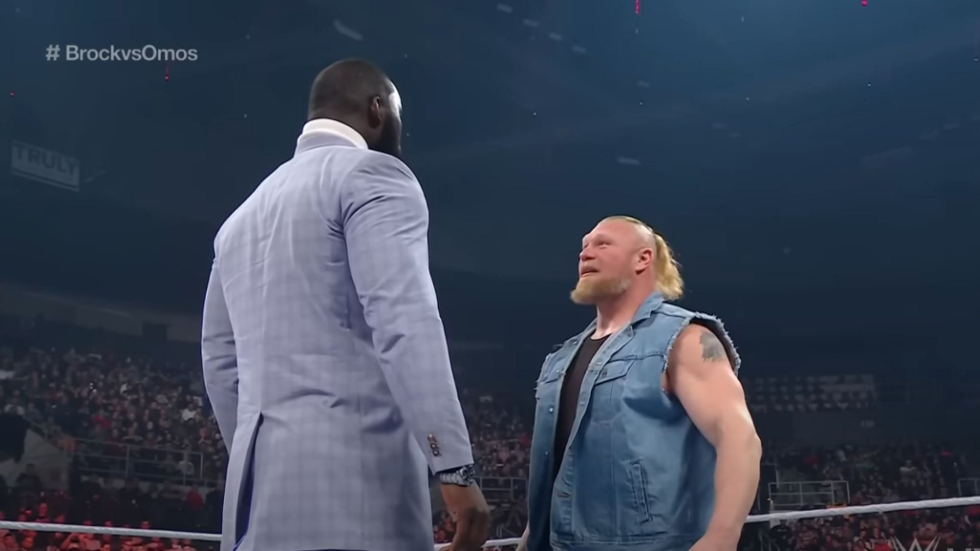 Omos (left) and Brock Lesnar (right)