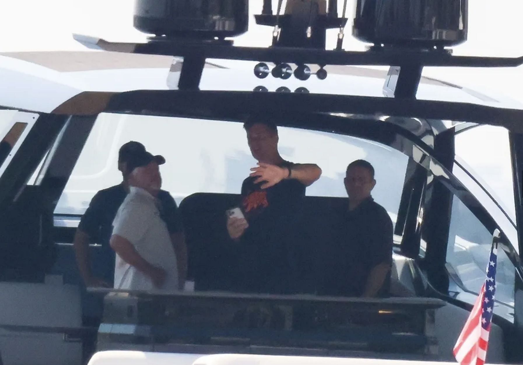Brady hanging out with friends aboard TW12VE ANGELS. Credit: TMZ