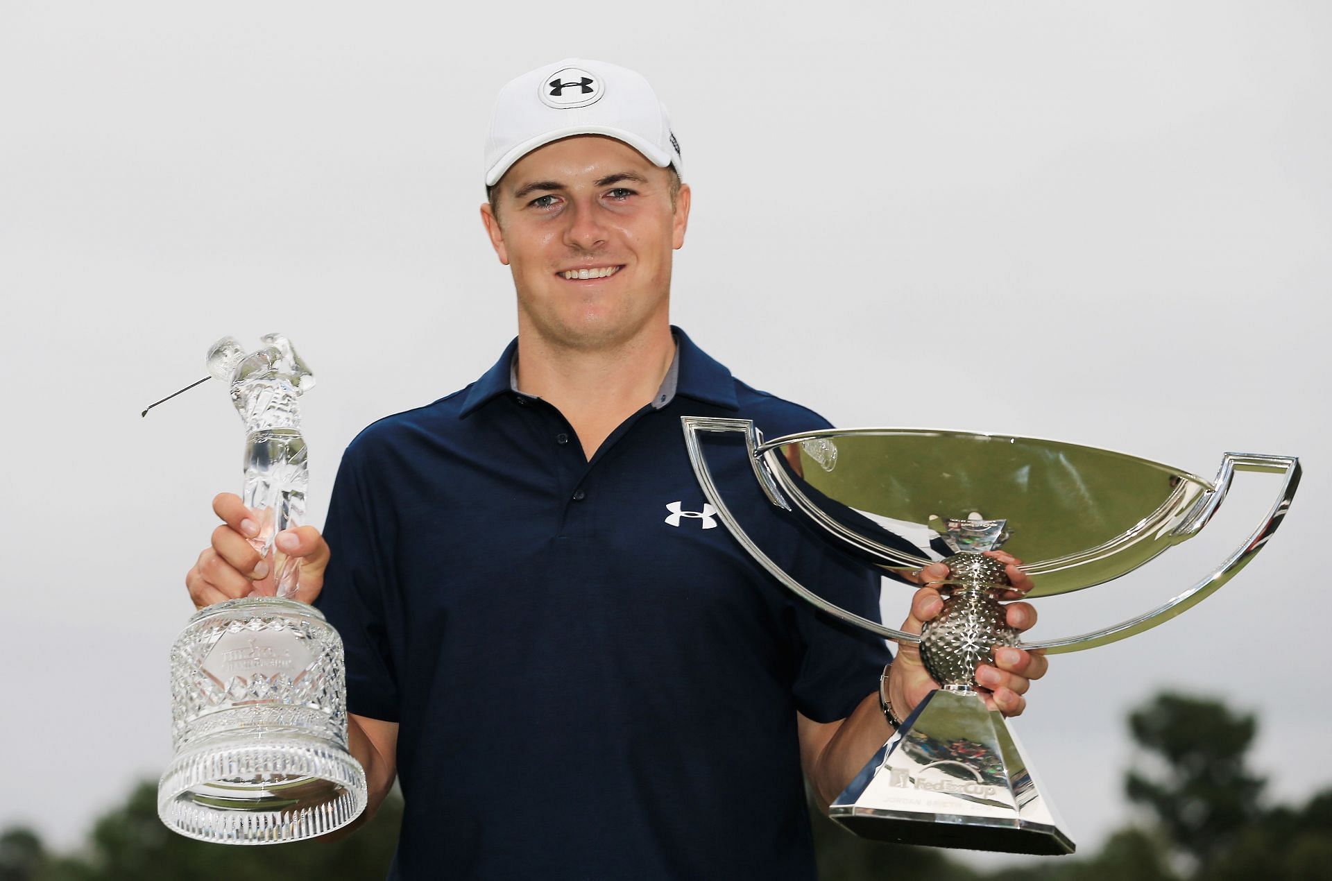 On September 27, 2015, in Atlanta, Georgia, Jordan Spieth of the United States poses on the 18th green after winning both the TOUR Championship By Coca-Cola and the FedExCup.