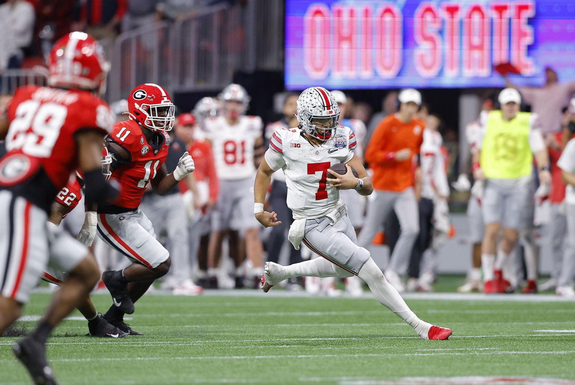 C.J. Stroud #7 of the Ohio State Buckeyes rushes during the fourth quarter against the Georgia Bulldogs