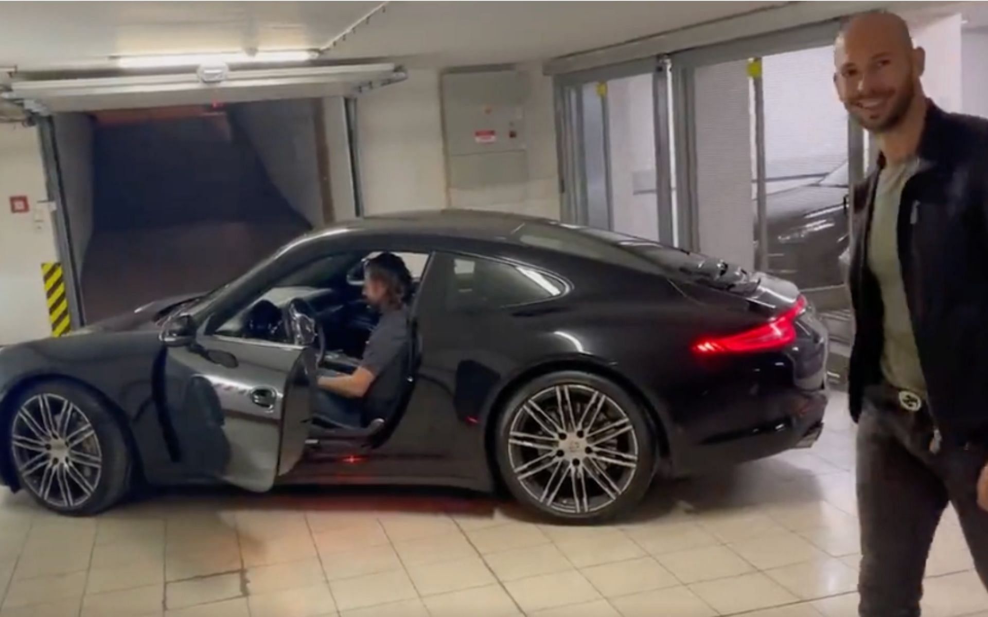 Andrew Tate and the gifted Porsche. [via Twitter @cobratate]