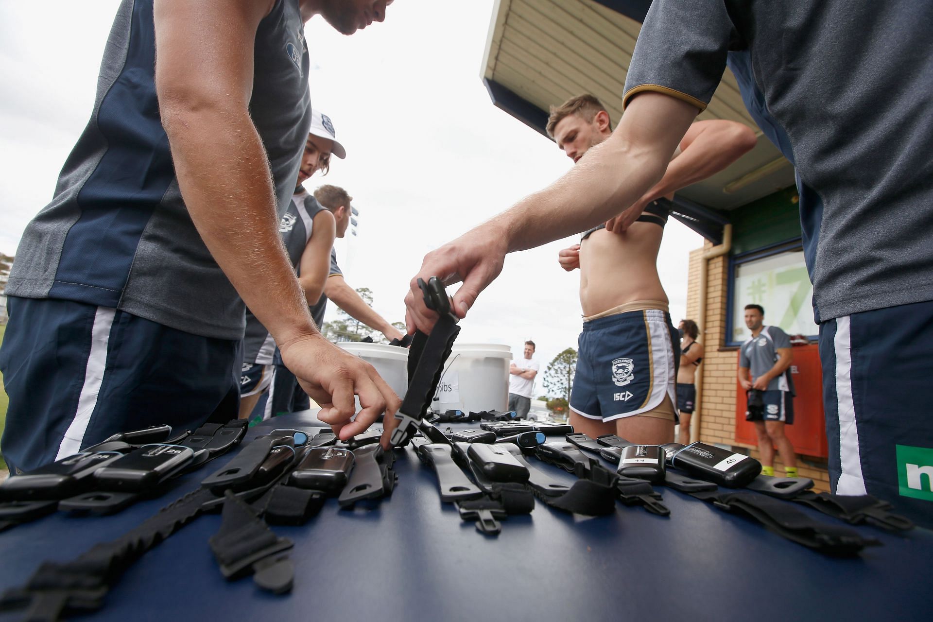 Assembling the Heart rate monitors before the training practice (Image via Getty)