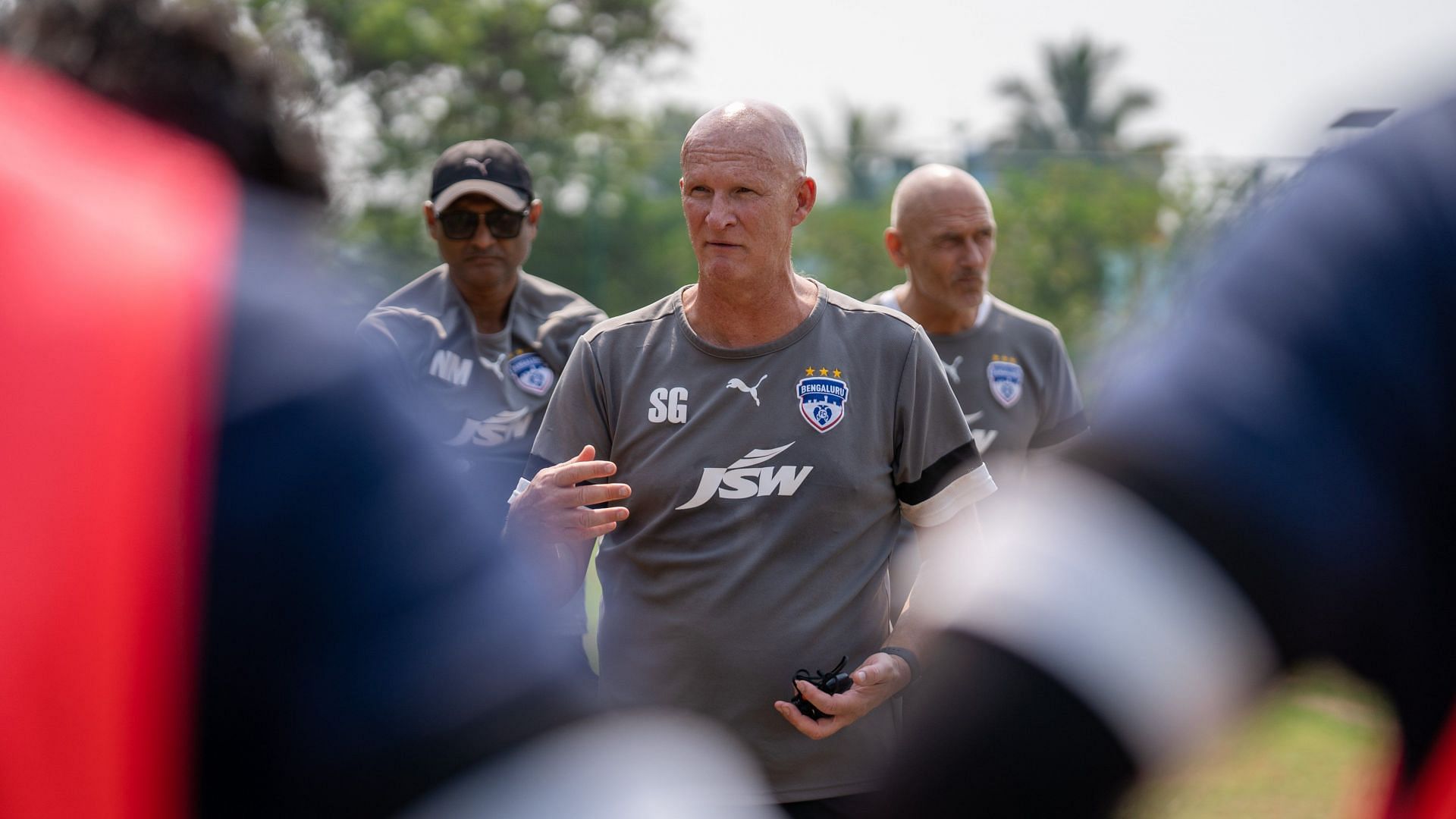 Simon Grayson looks on as the Bengaluru FC players train.