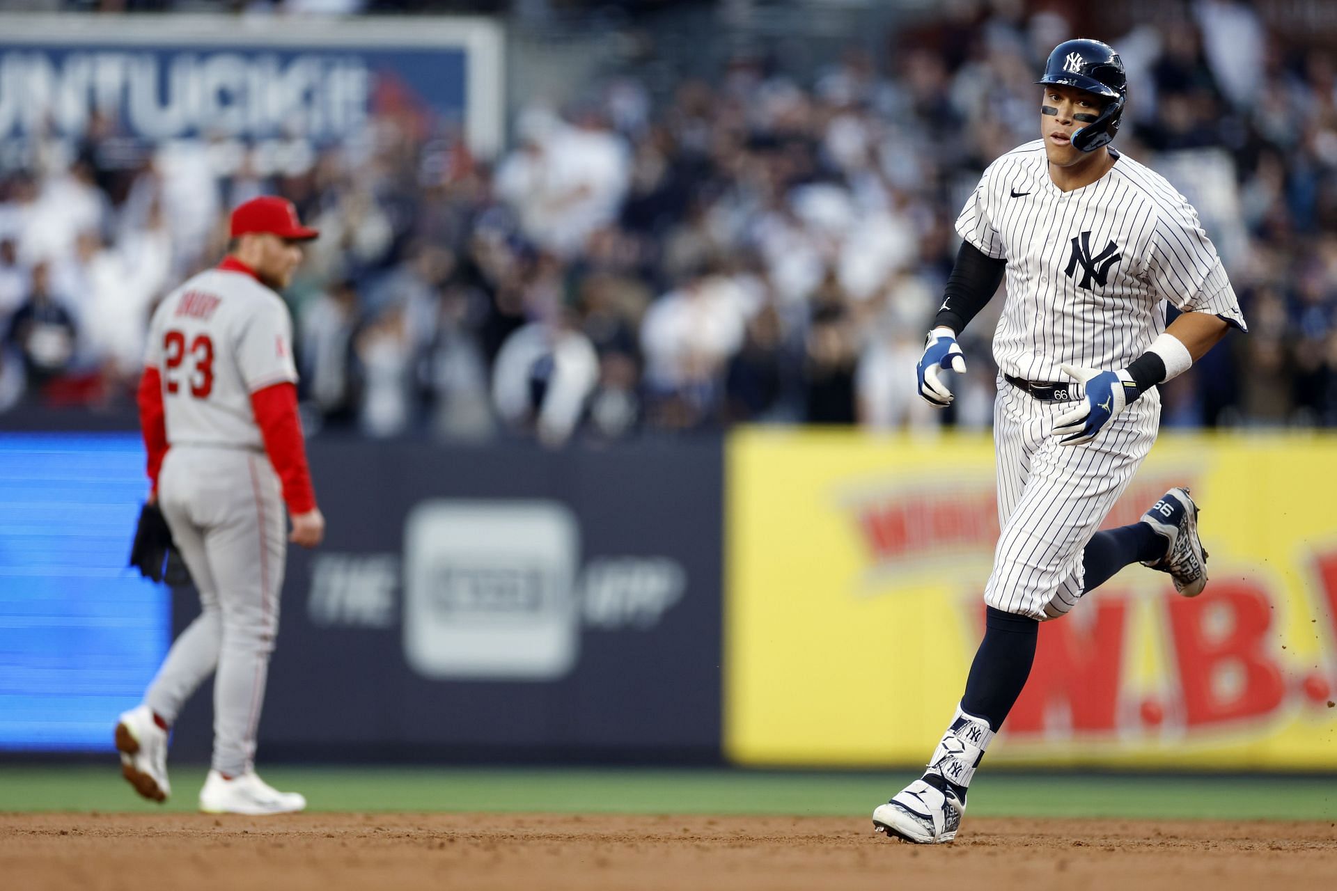 Aaron Judge of the New York Yankees rounds the bases after hitting a  two-run homer during the first inning of a baseball game against the Los  Angeles Angels at Yankee Stadium in