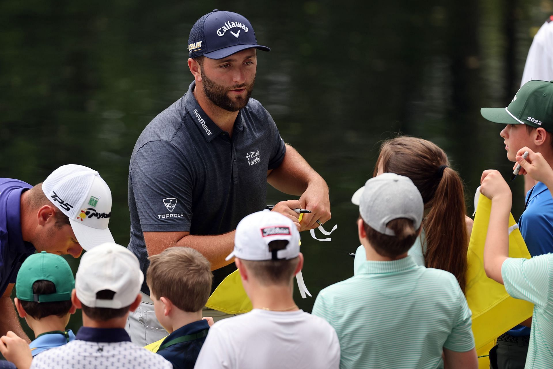 Jon Rahm signing autographs at the Masters