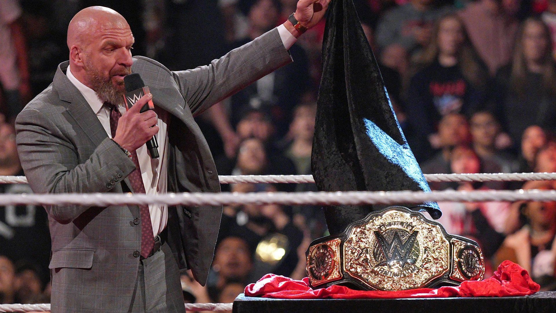 Triple H unveils the World Heavyweight Championship.