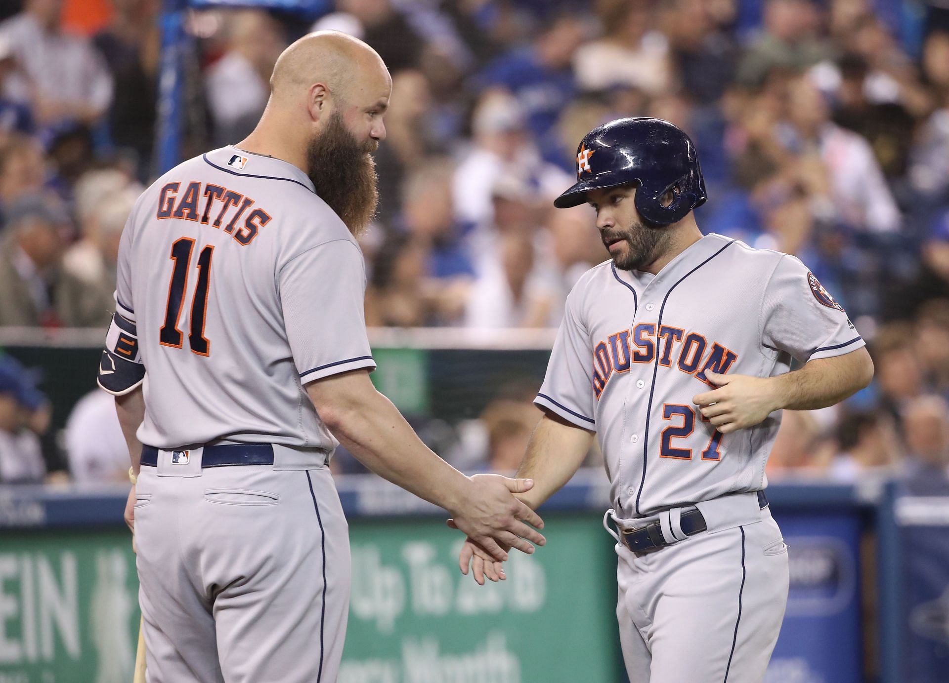 Jose Altuve, right, of the Houston Astros is congratulated by Evan Gattis.