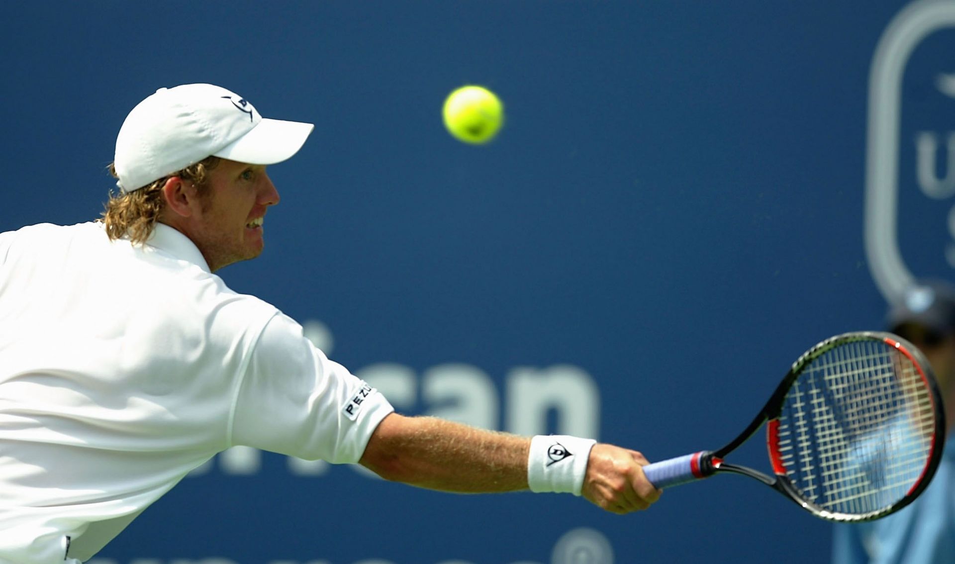 Johansson in action agaisnt Roger Federer at the Tennis Masters Canada.