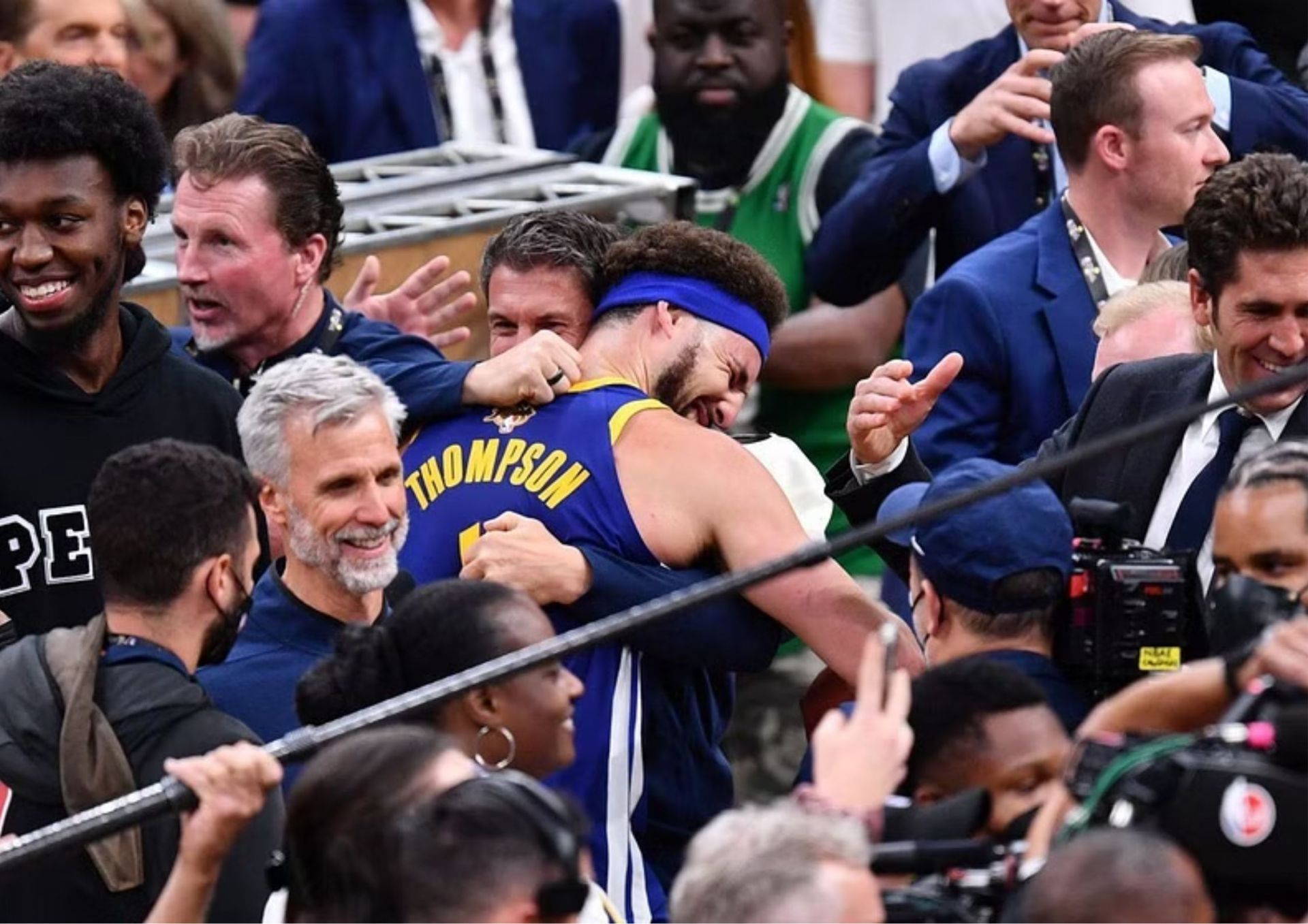 Klay Thompson hugs Rick Celebrini, the Golden State Warriors