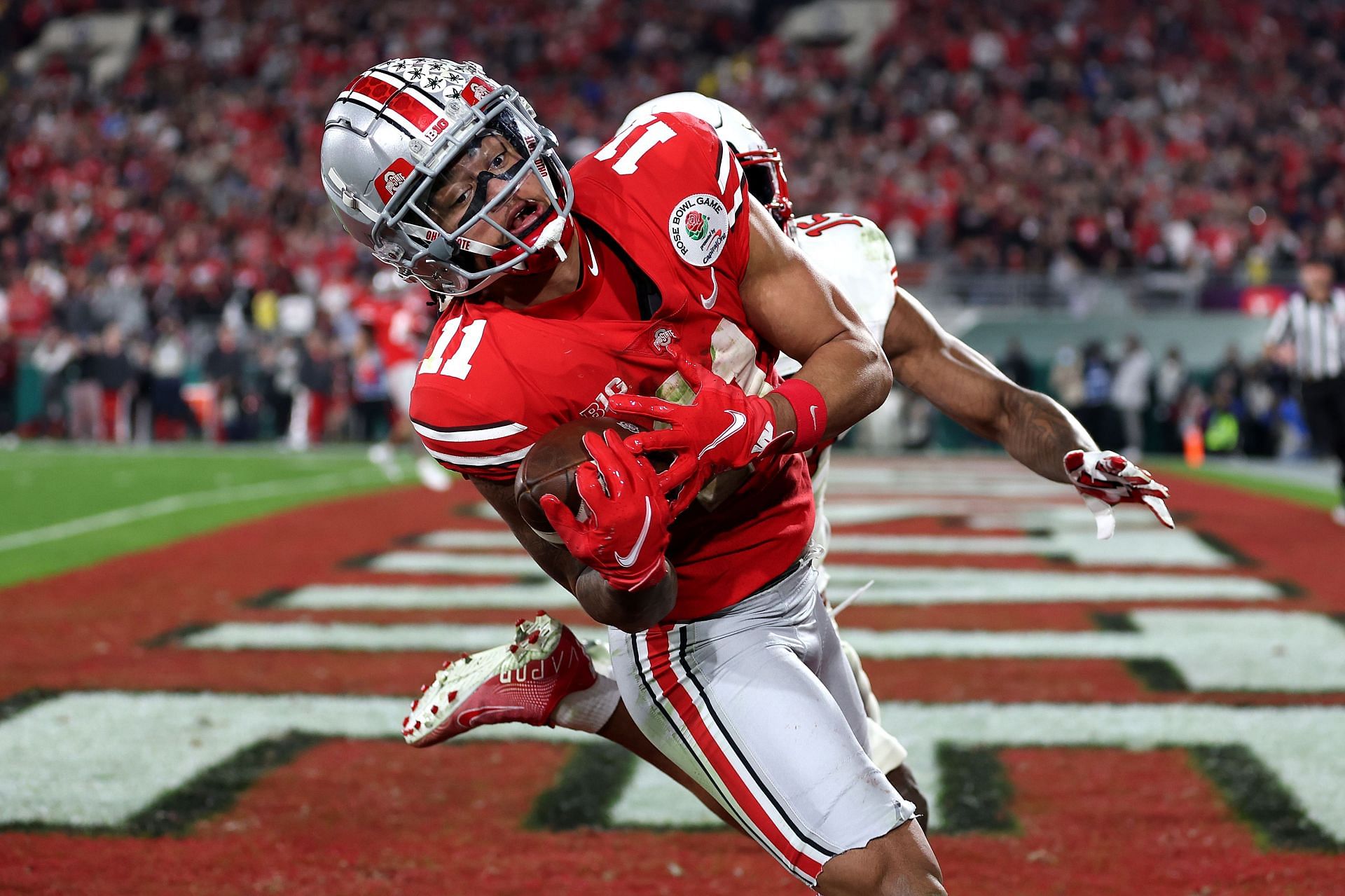 Jaxon Smith-Njigba #11 of the Ohio State Buckeyes catches a touchdown pass