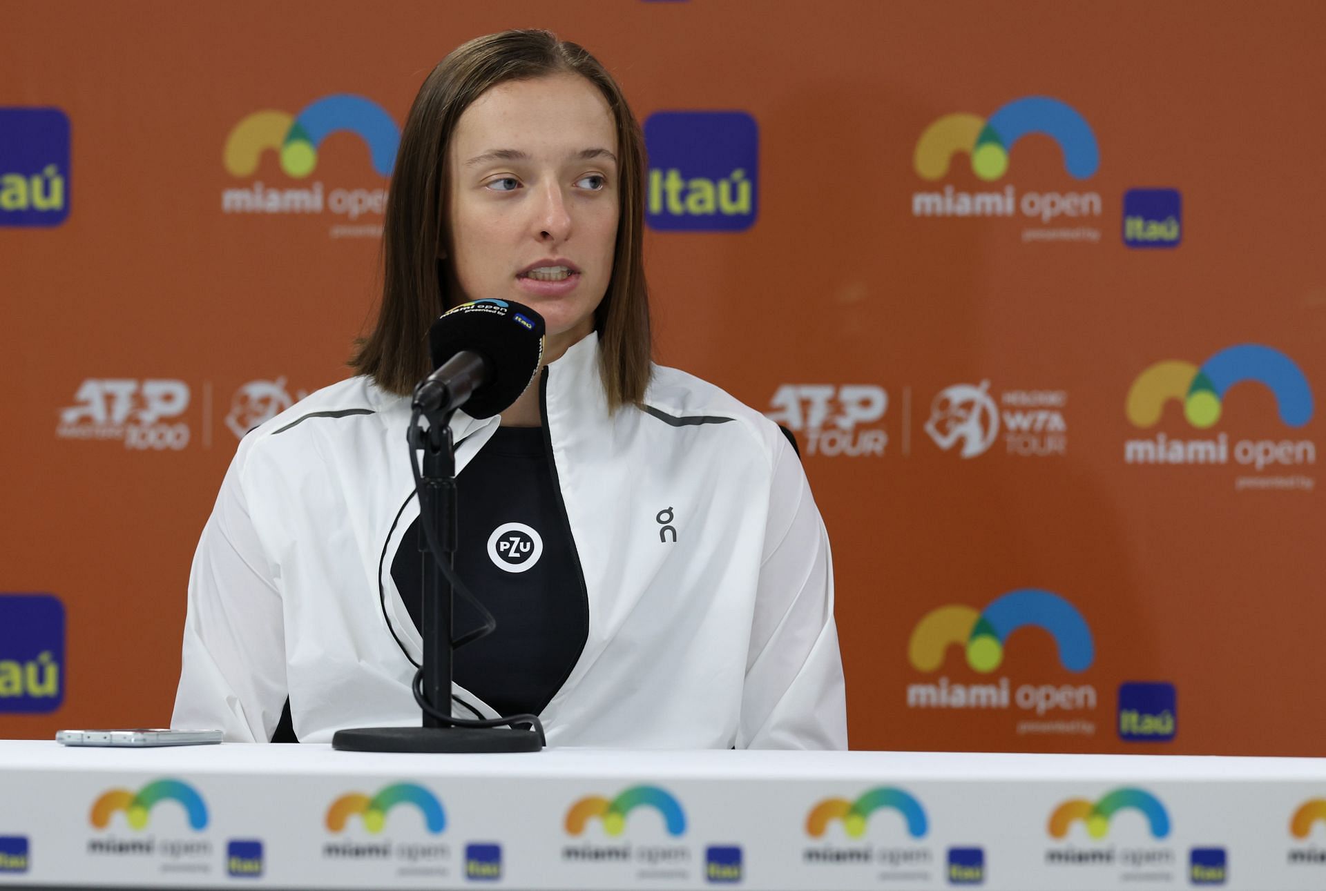 Iga Swiatek wearing On during the 2023 Miami Open withdrawal announcement.