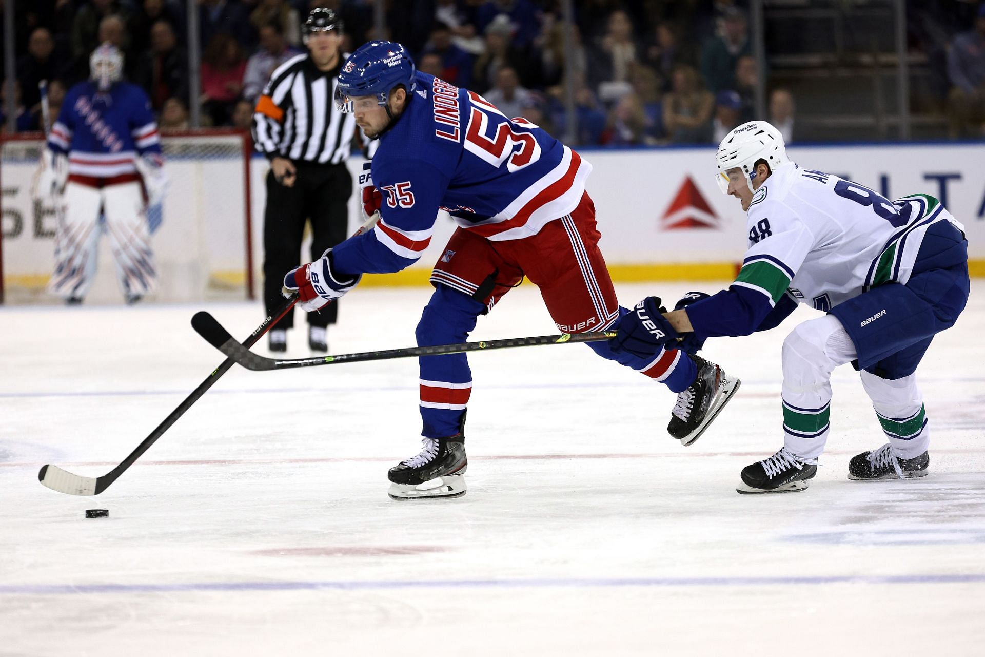 Ryan Lindgren #55 of the New York Rangers skates with the puck