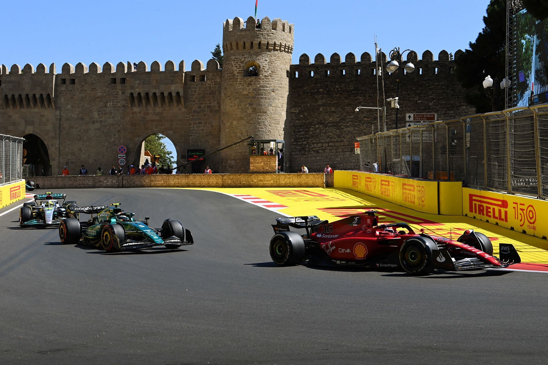 Cars zoom past the castle section of Baku city circuit in 2023 Azerbaijan GP