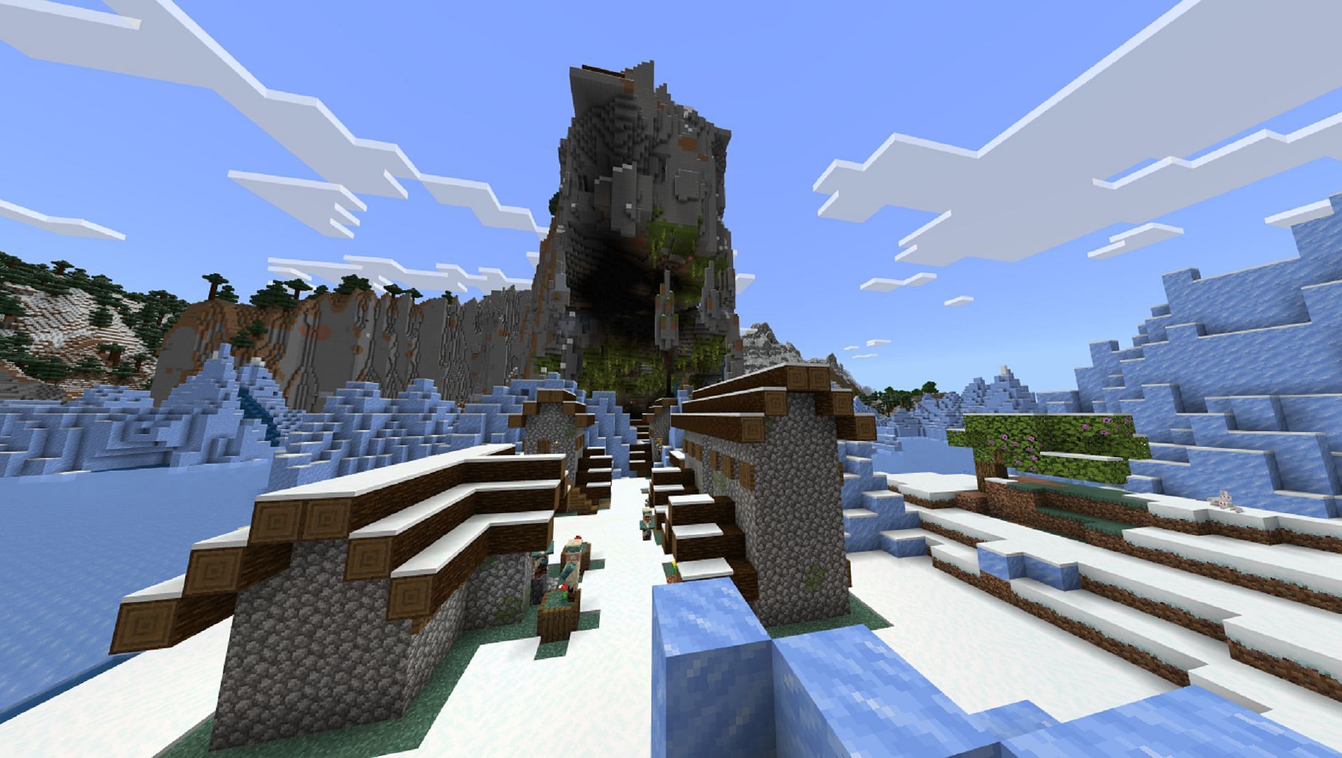 This seed&#039;s village and lush cave combo rests in the middle of a frigid ice spikes biome (Image via Mojang)