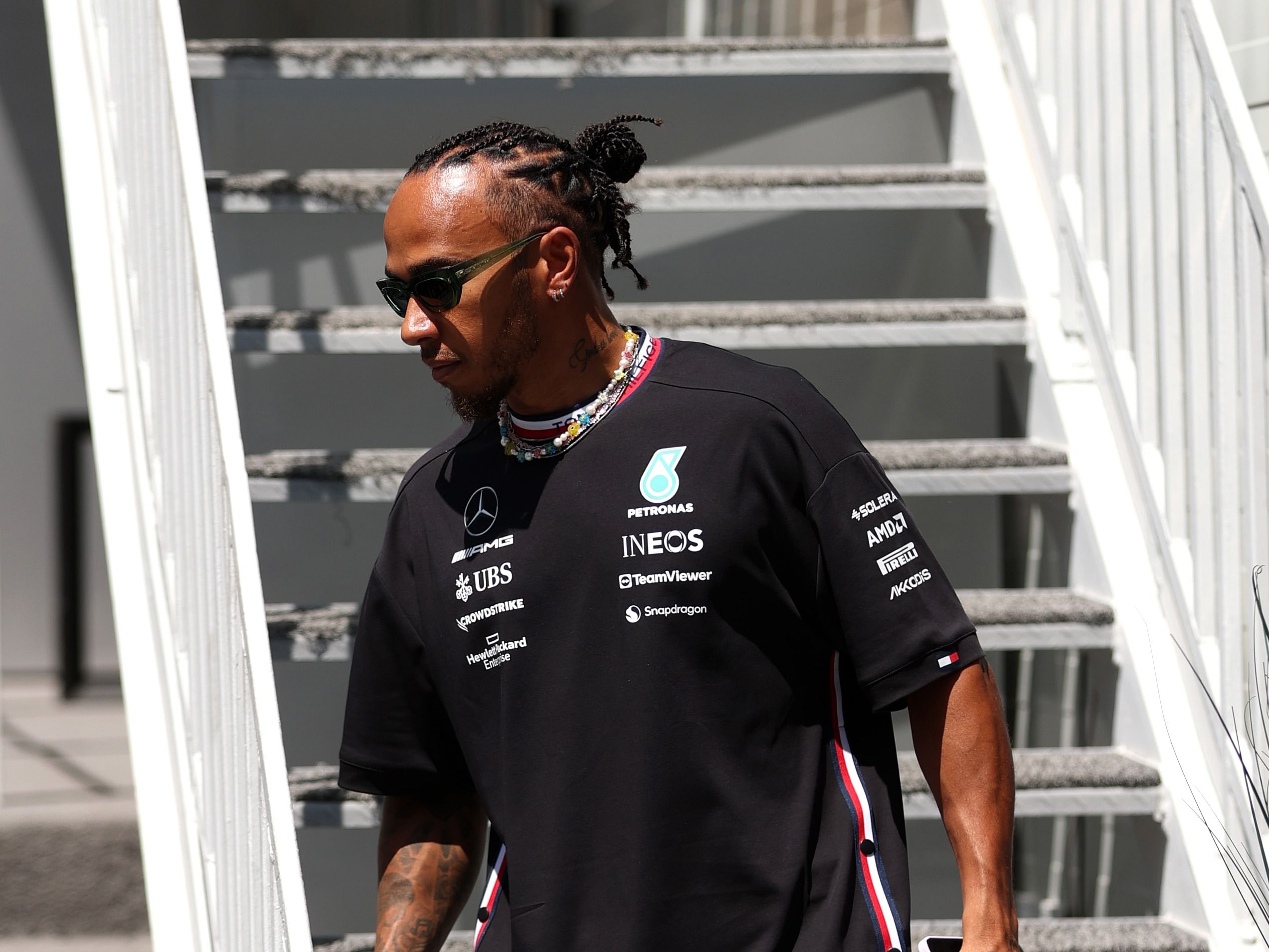 Lewis Hamilton walks through the paddock ahead of the 2023 F1 Azerbaijan Grand Prix. (Photo by Alex Pantling/Getty Images)