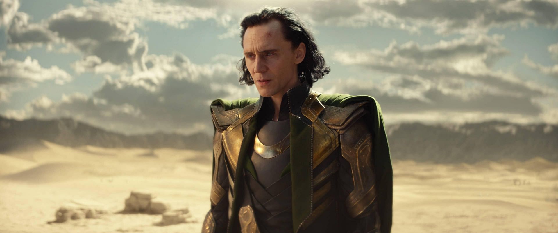 Tom Hiddleston as Loki, looking mischievous and charming in his green and gold costume (Image via Marvel Studios)