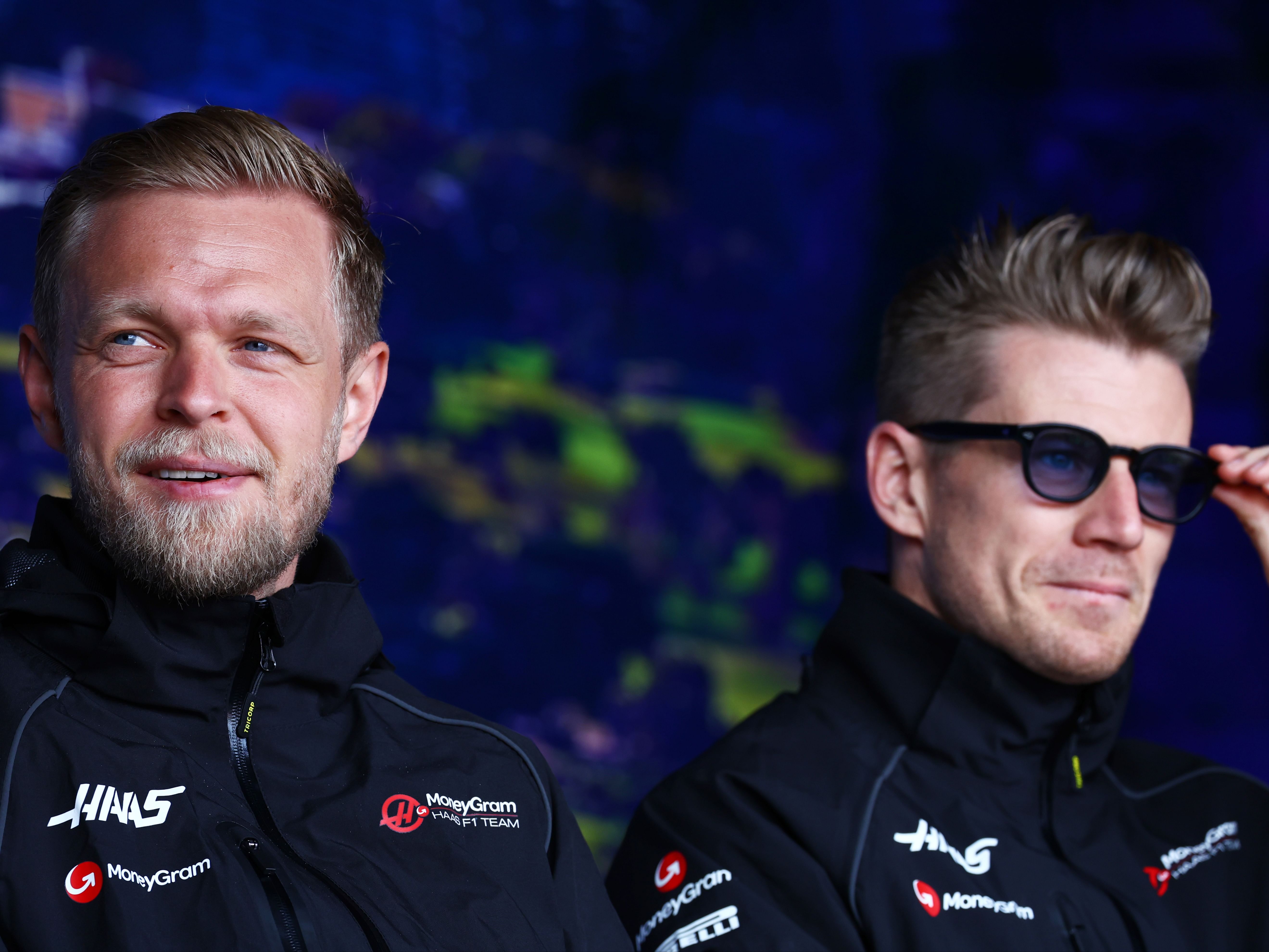 Nico Hulkenberg and Kevin Magnussen look on from the fan stage prior to final practice ahead of the 2023 F1 Australian Grand Prix (Photo by Mark Thompson/Getty Images)