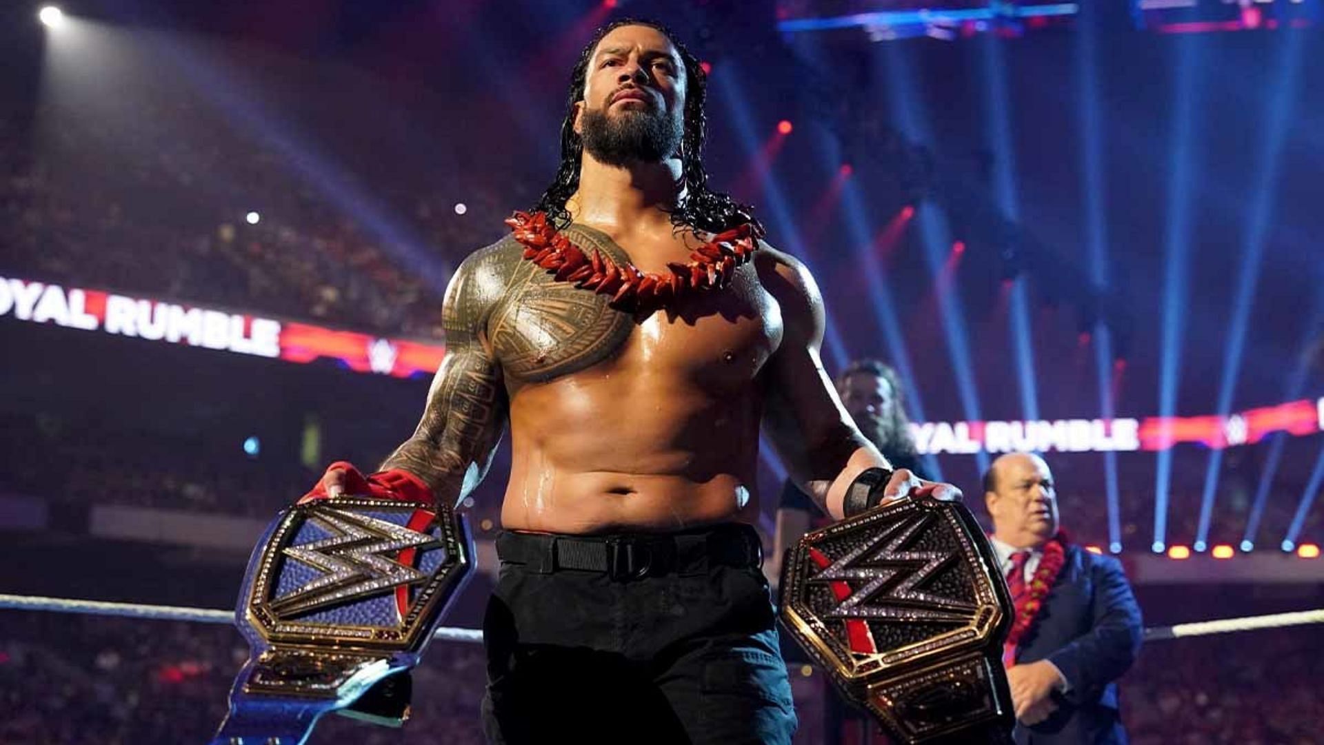 Who did Roman Reigns beat to win the WWE and Universal Championships?
