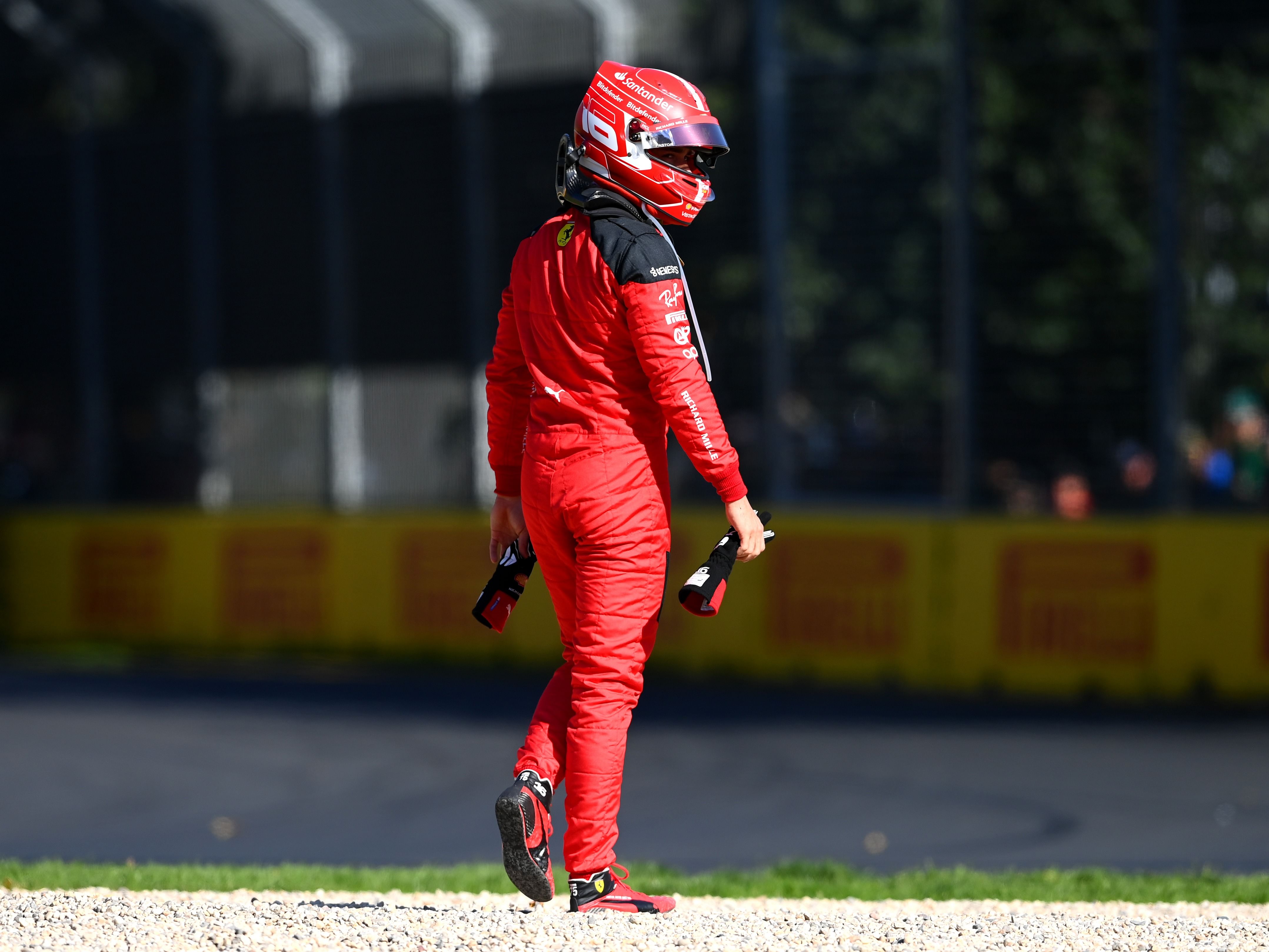 Charles Leclerc walks from his car after retiring from the race during the 2023 F1 Australian Grand Prix (Photo by Quinn Rooney/Getty Images)
