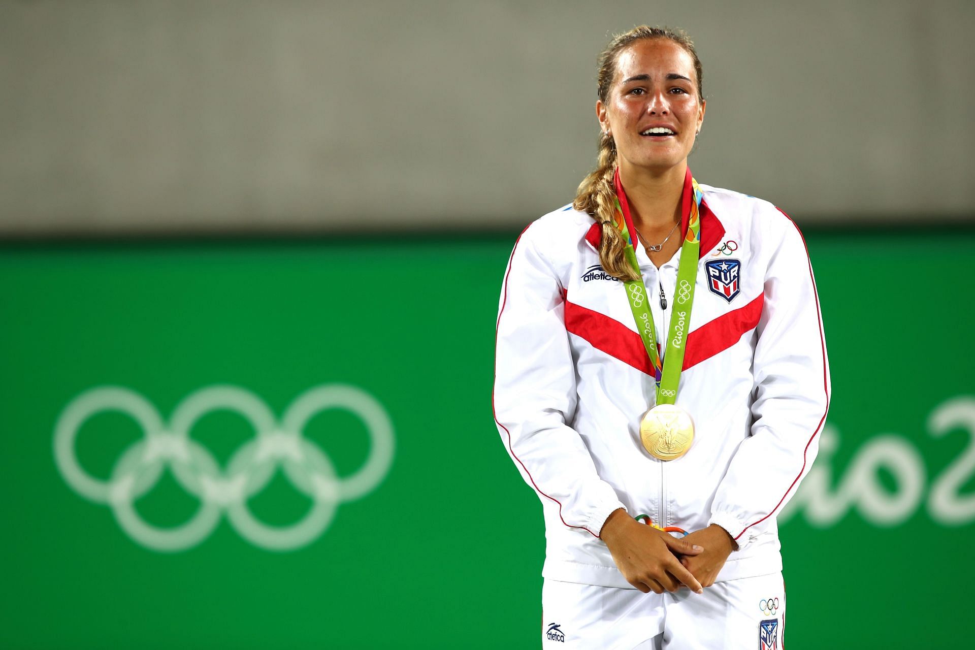 Monica Puig with her gold Olympic medal